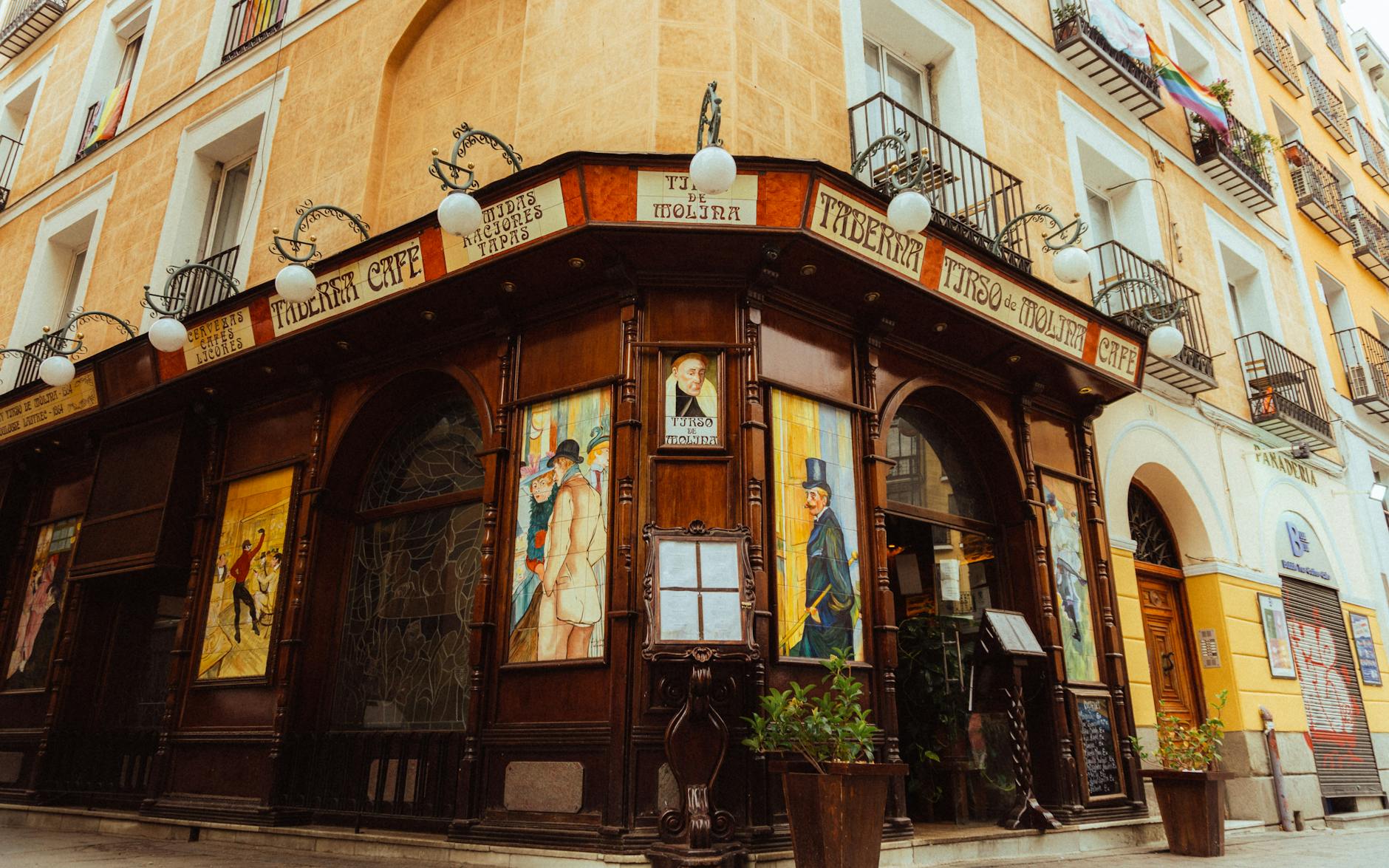 Classic cafe facade with murals in Madrid