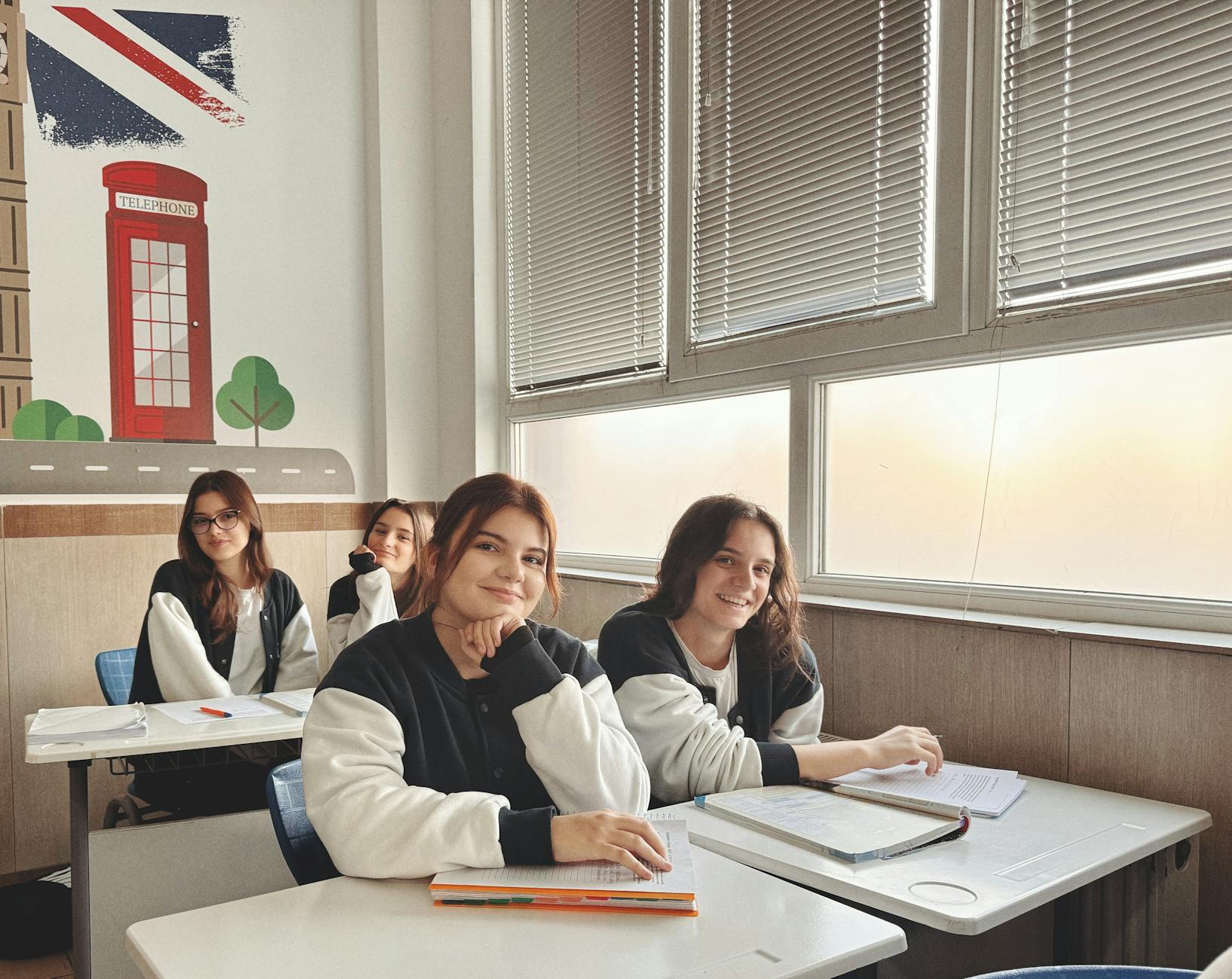 Students studying in a sunlit classroom