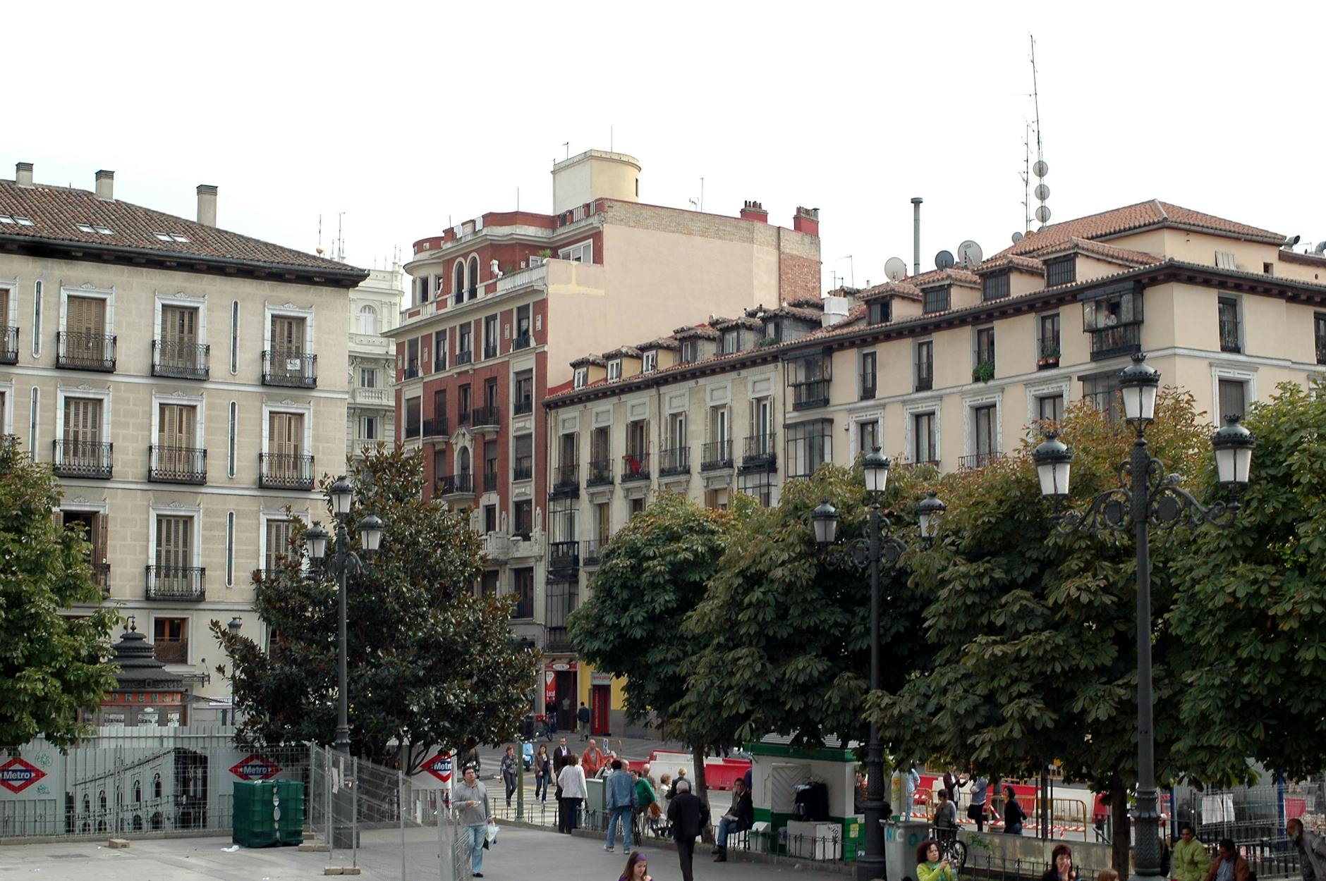 Busy Madrid plaza with historic architecture and street life
