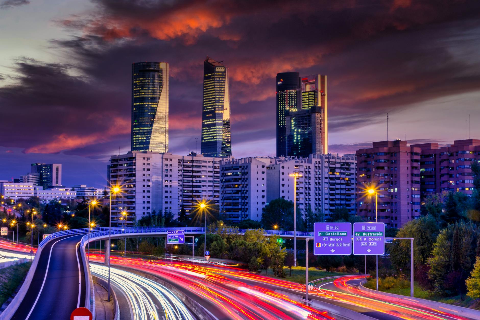 Madrid skyline at dusk with city light trails