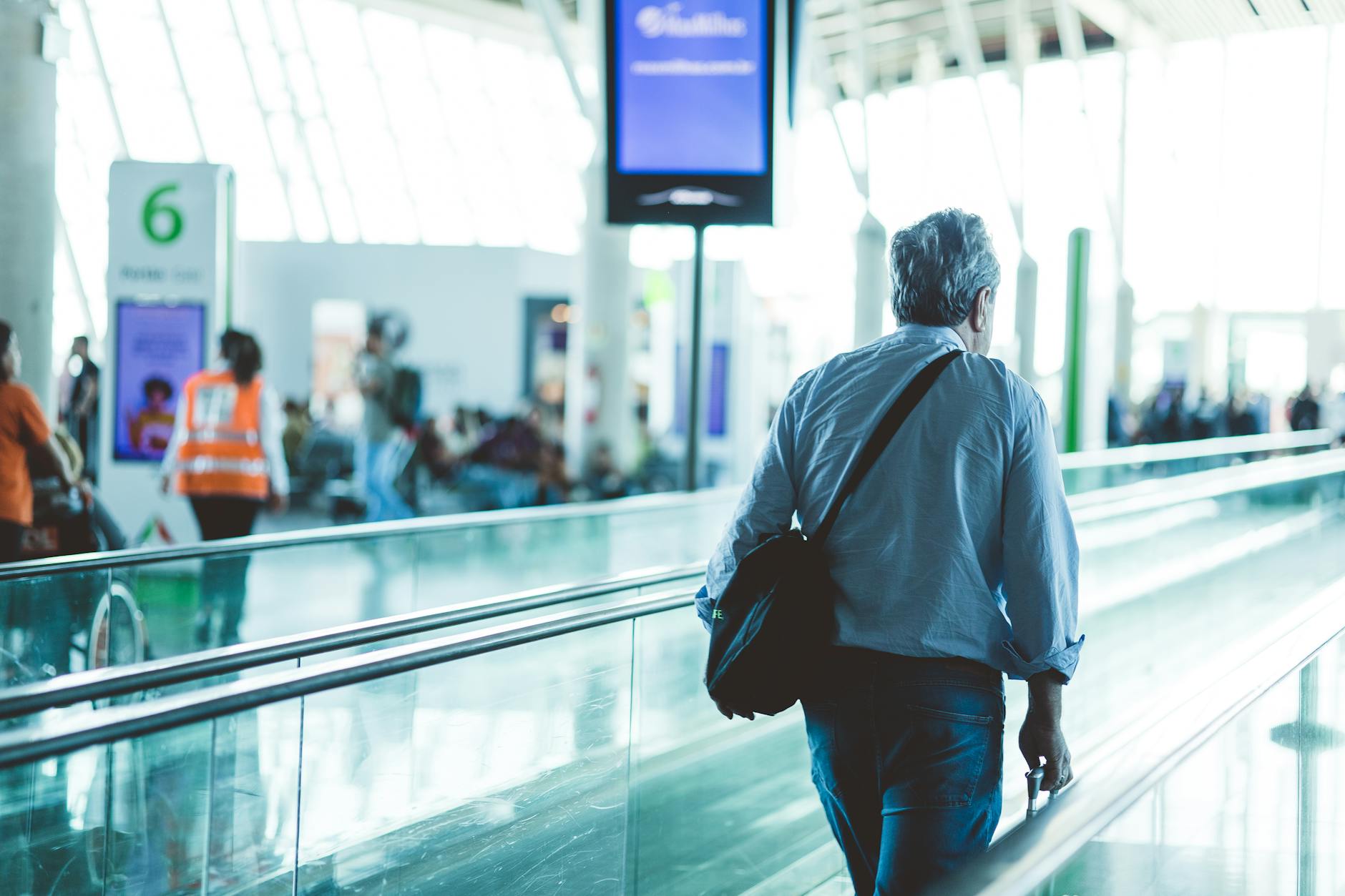 Traveler walking on an airport travelator