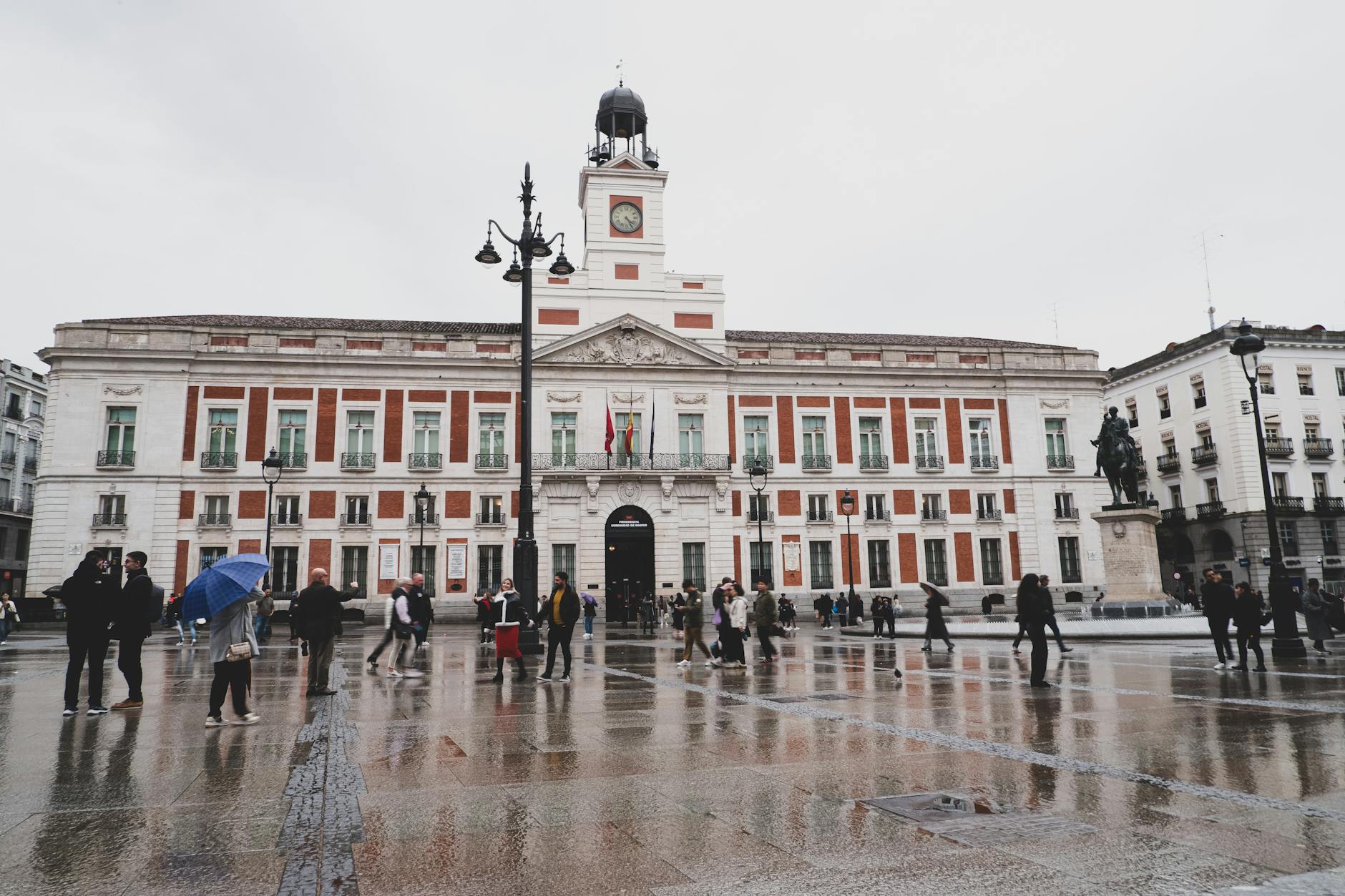 Puerta del Sol in Madrid with pedestrians and historic architecture