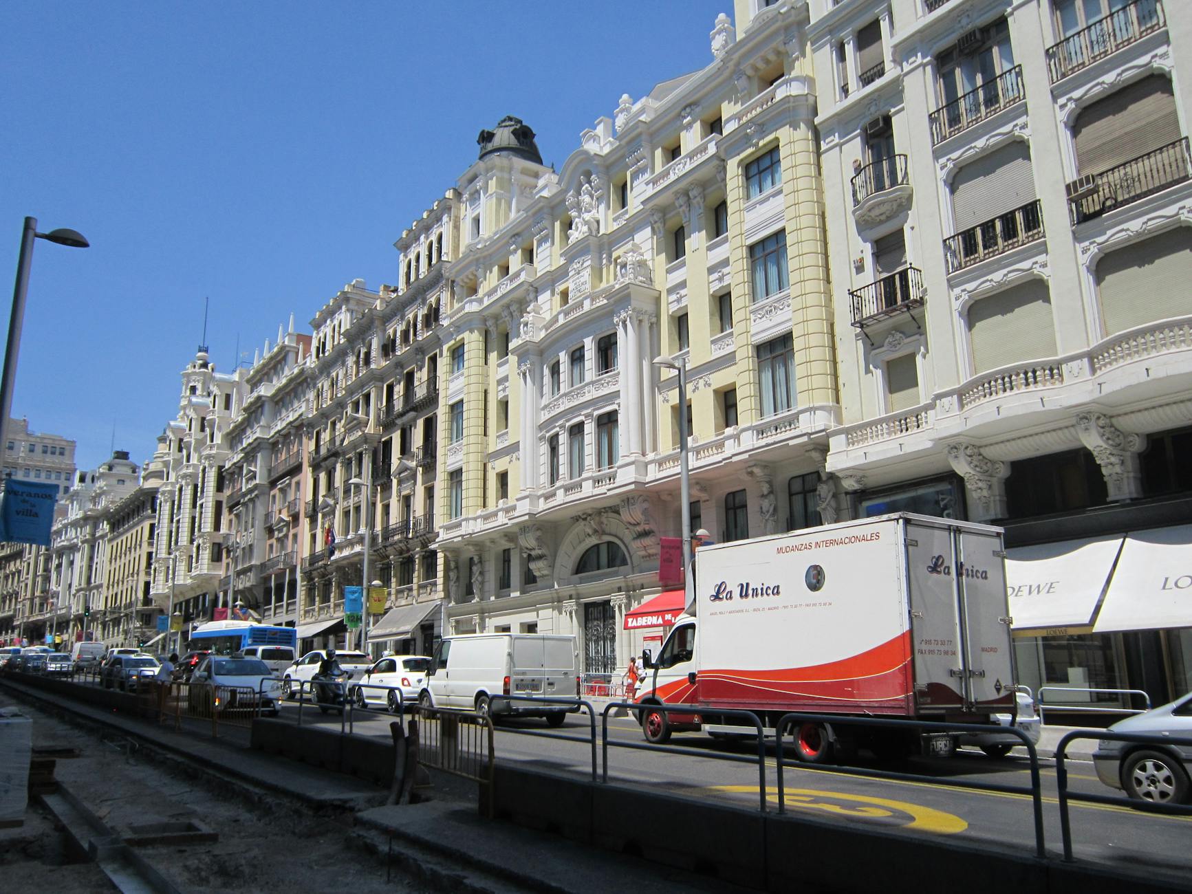 Busy Gran Via street in Madrid on a sunny day