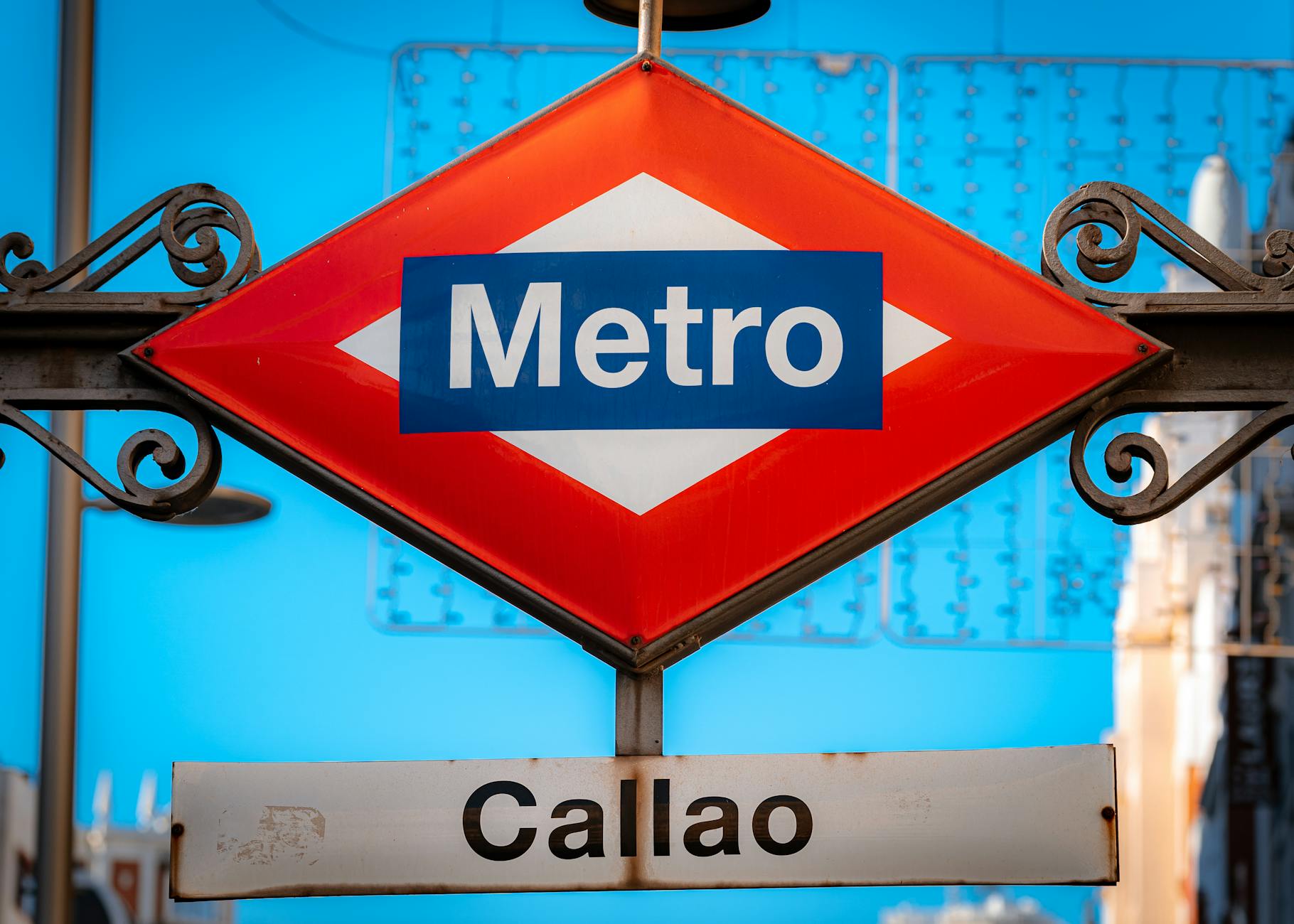 Madrid Metro sign at Callao station under a blue sky