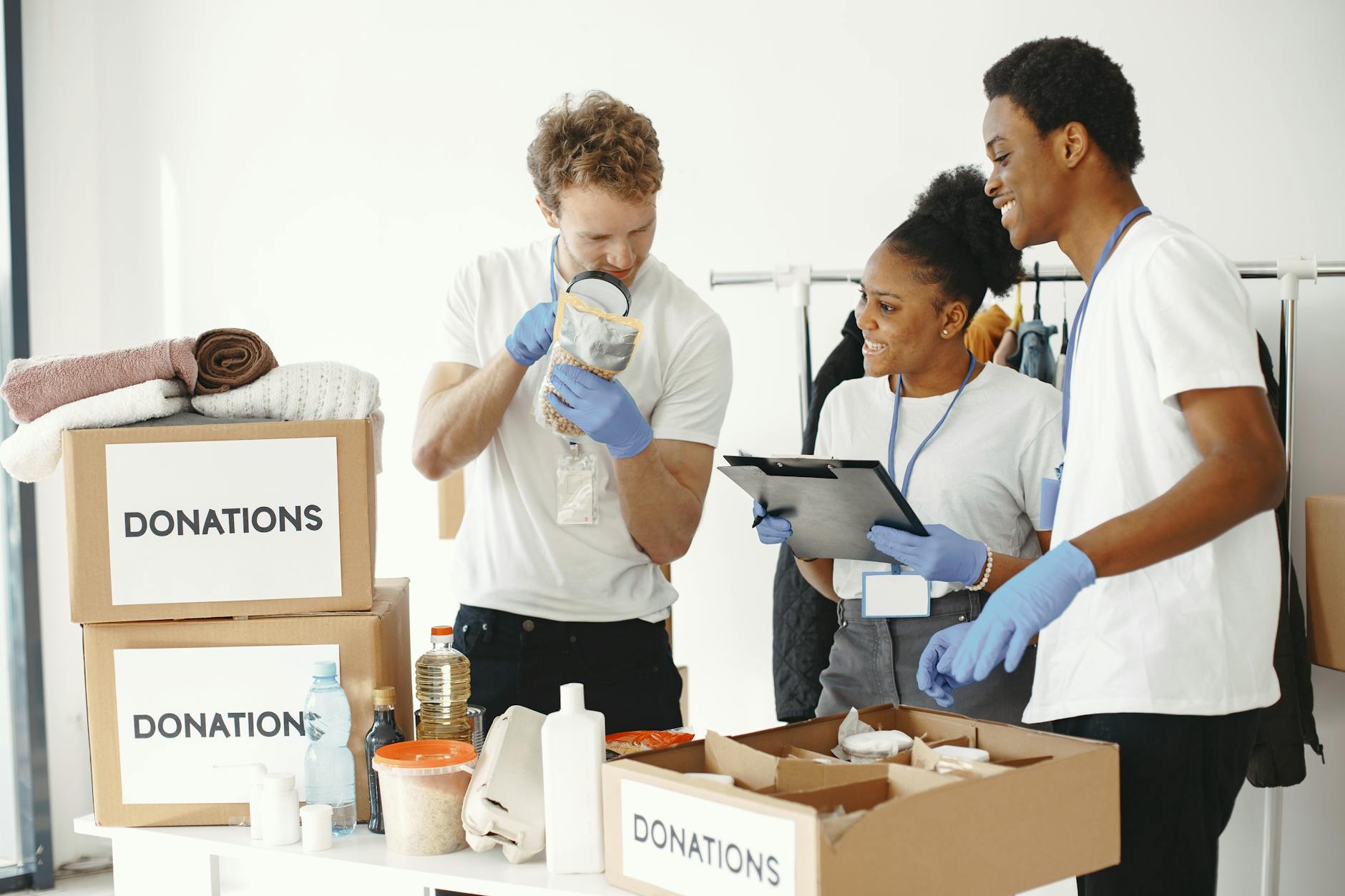 Volunteers sorting donation boxes indoors