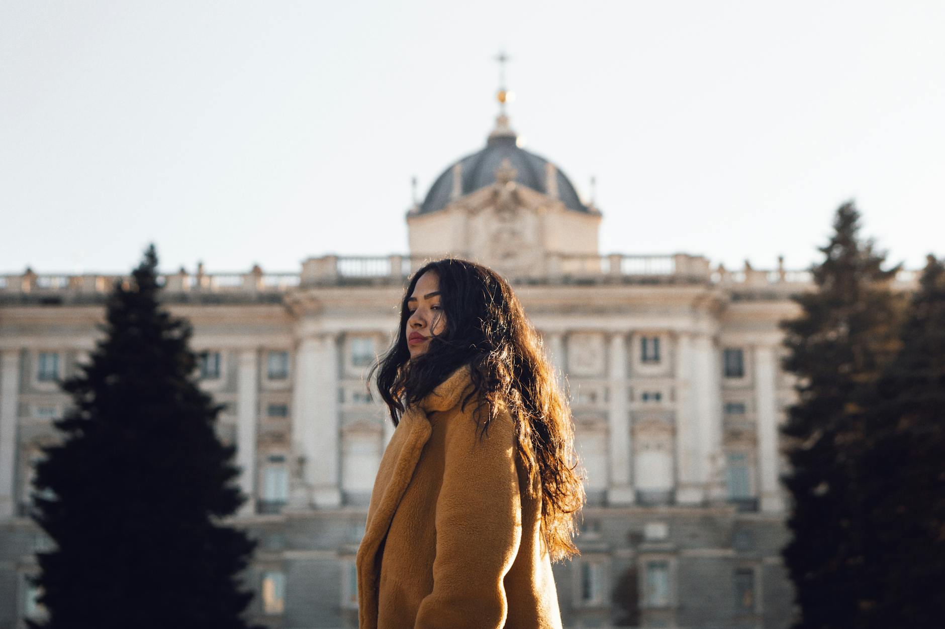 Woman standing outside the Royal Palace of Madrid