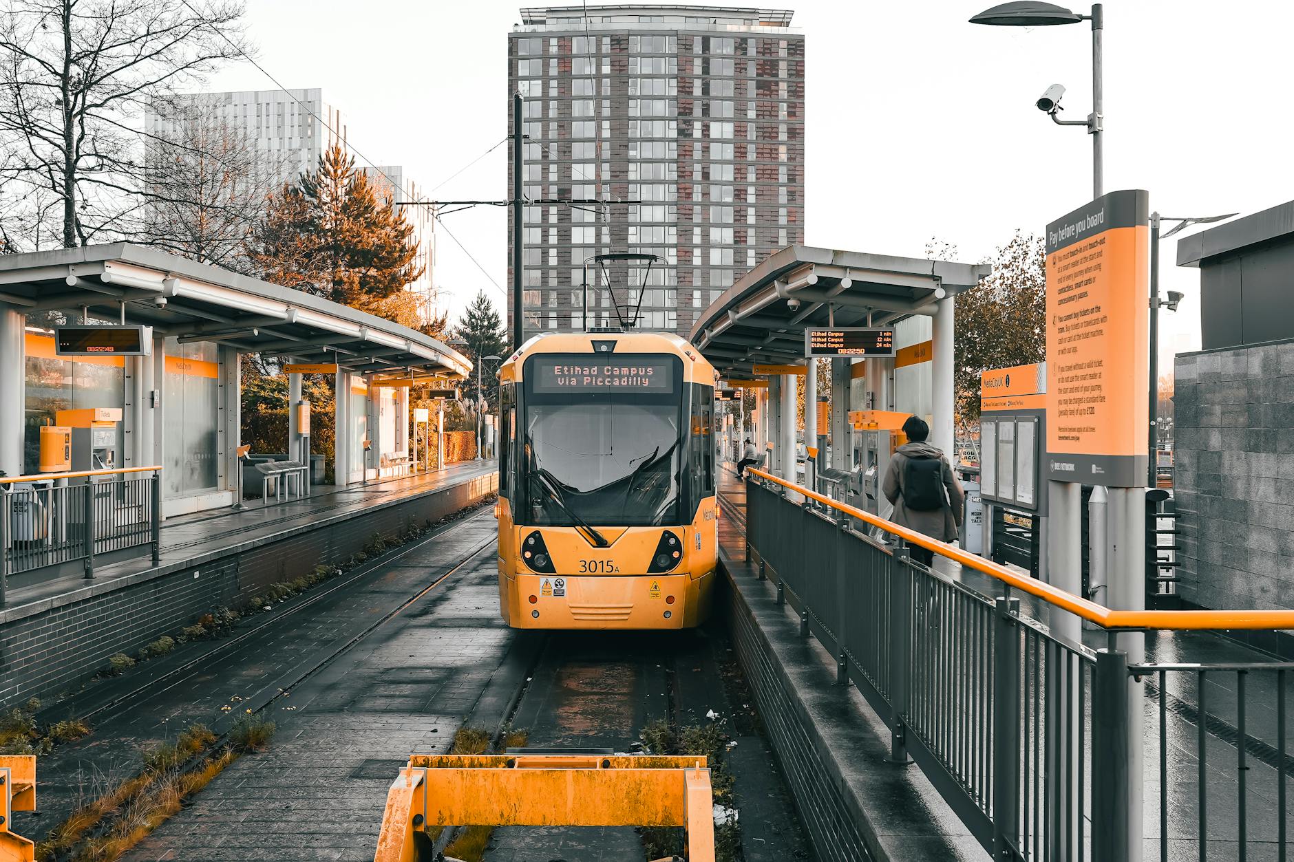 Yellow tram at sunset in Salford Quays