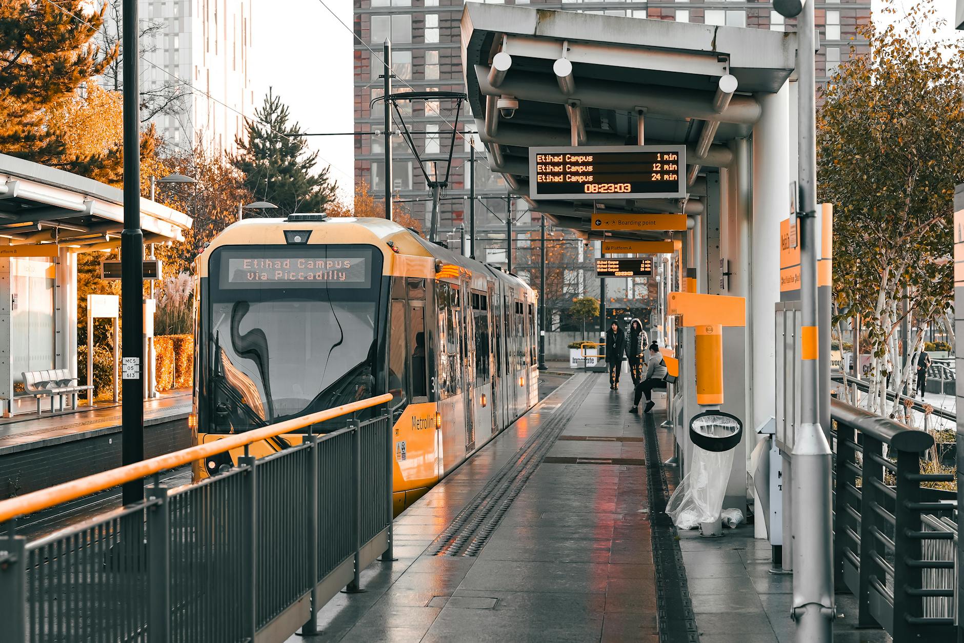 Tram at Salford Quays station near Manchester business and media offices