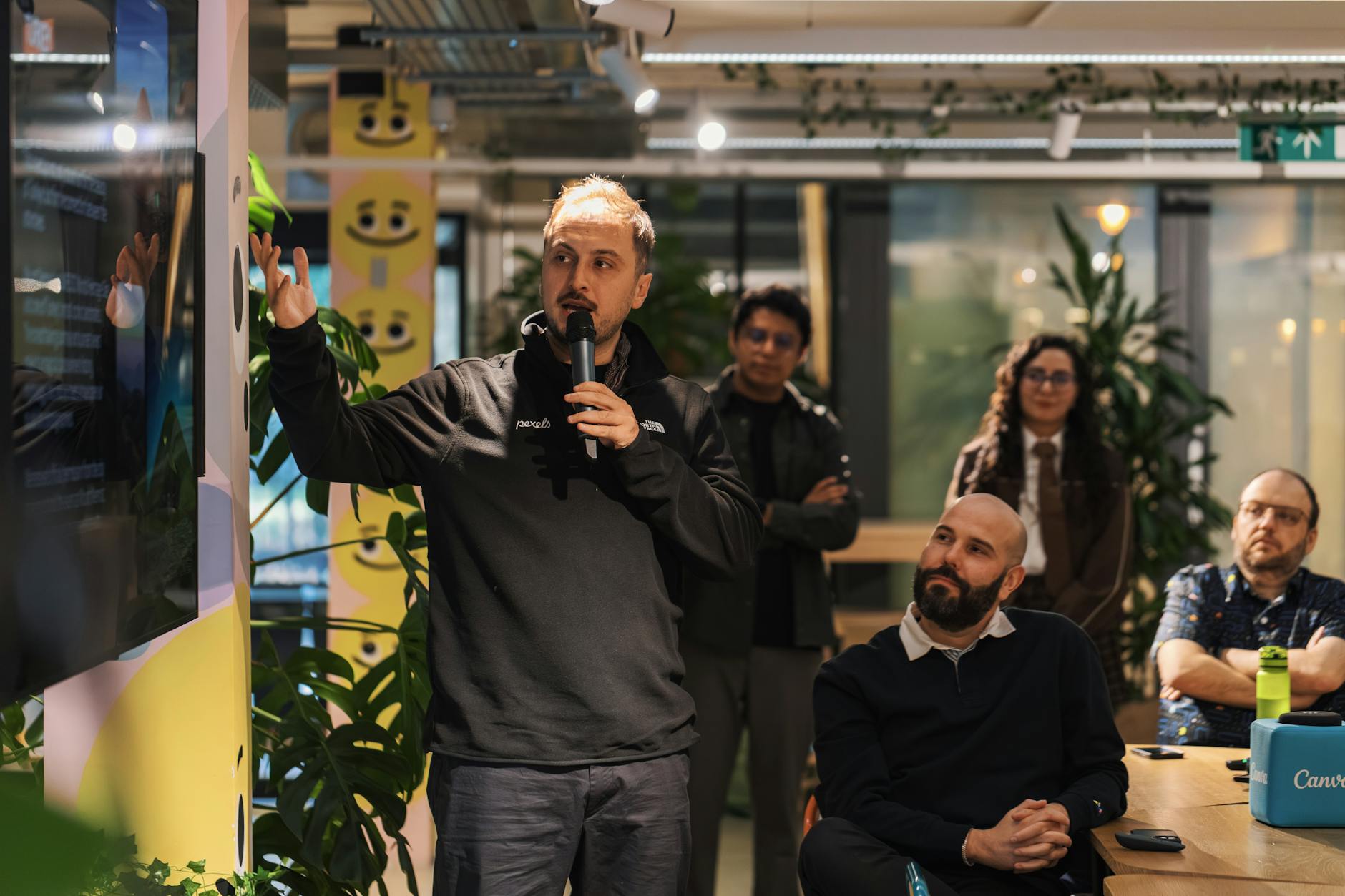 Presenter leading a business presentation in a modern office