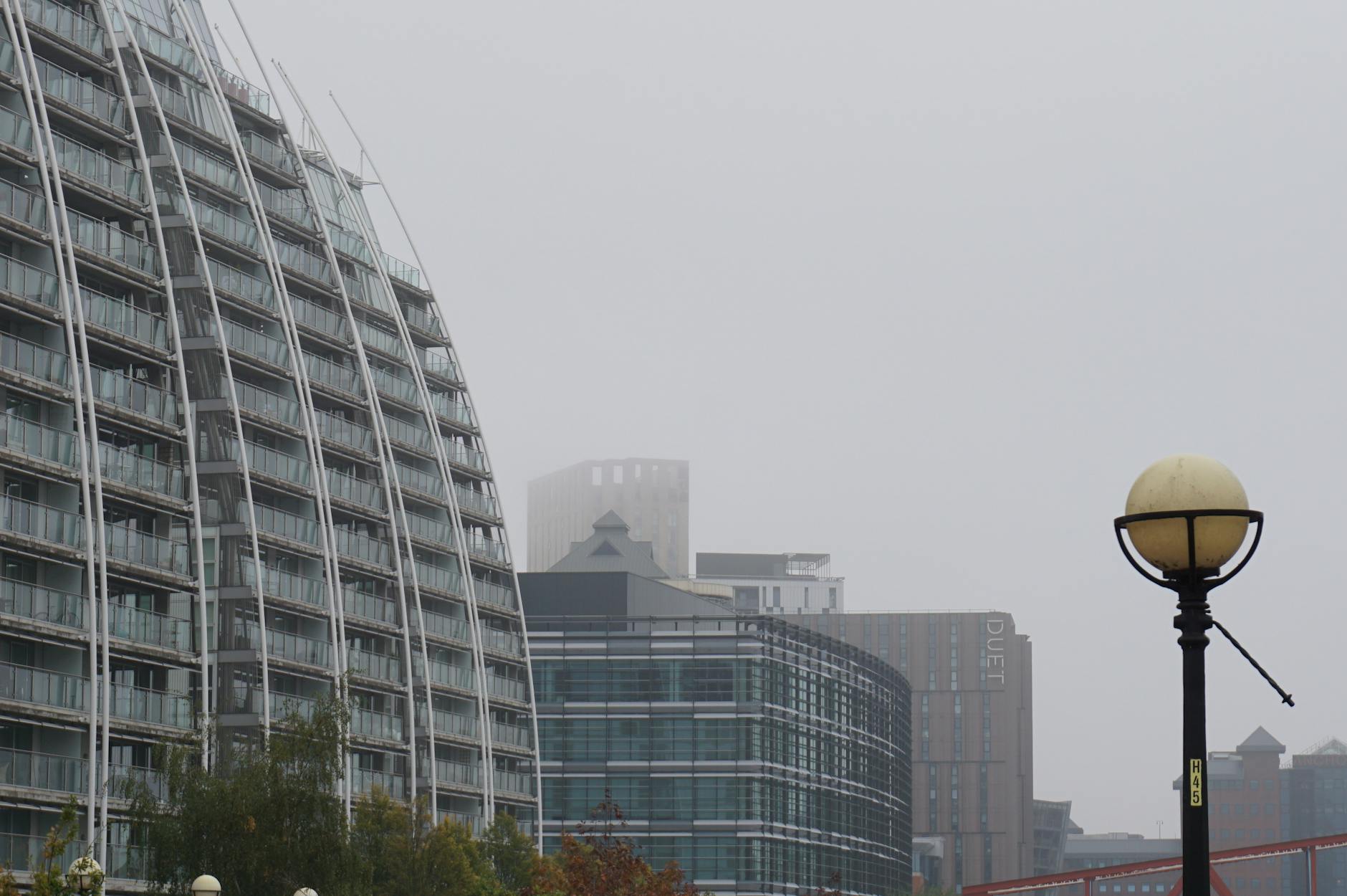 Foggy morning skyline around Salford modern buildings