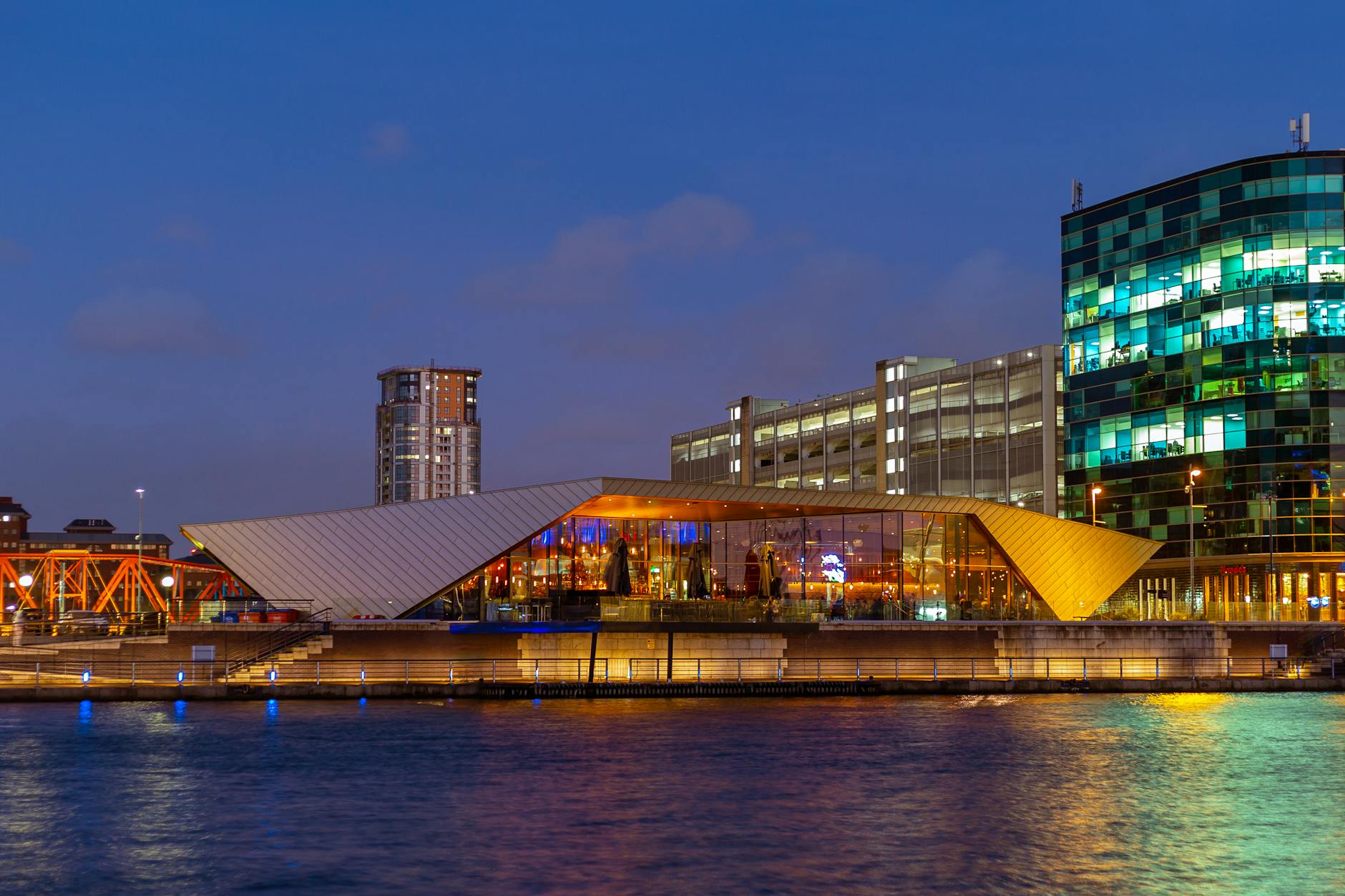 Manchester waterfront skyline illuminated at dusk