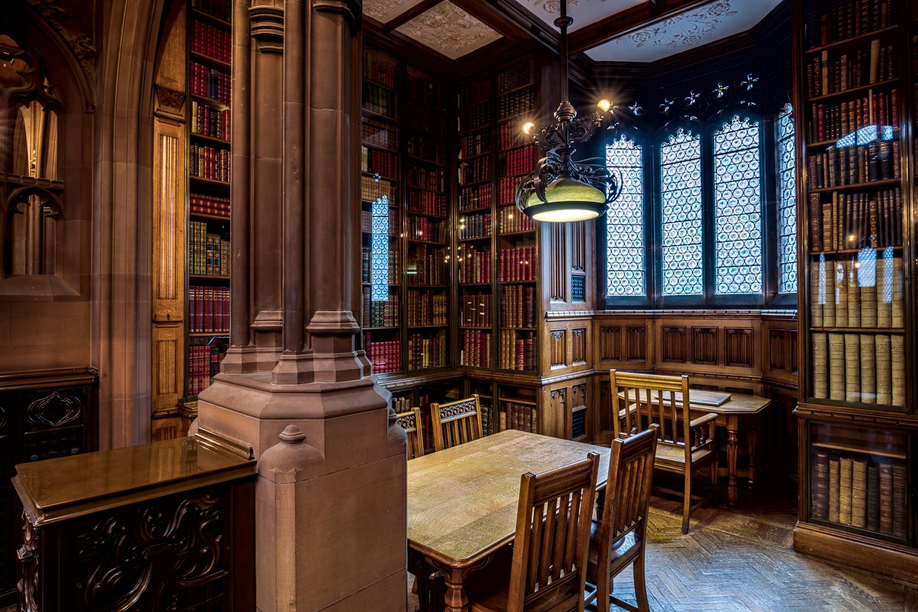 Historic Manchester library room with wooden bookshelves