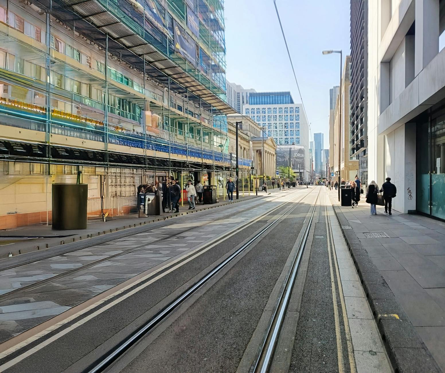 Manchester street with tram tracks and city construction