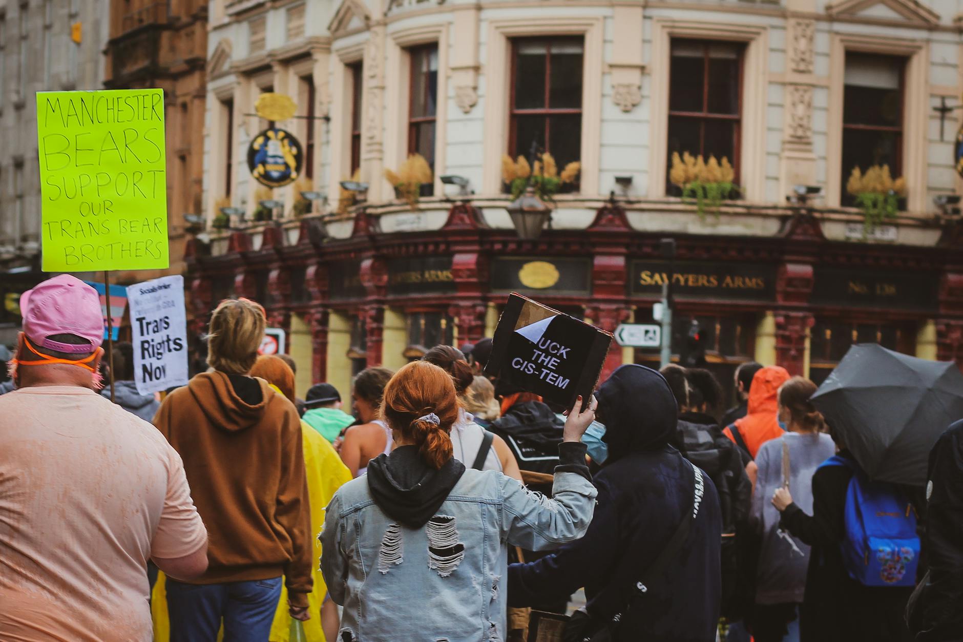 Manchester street protest with people carrying signs
