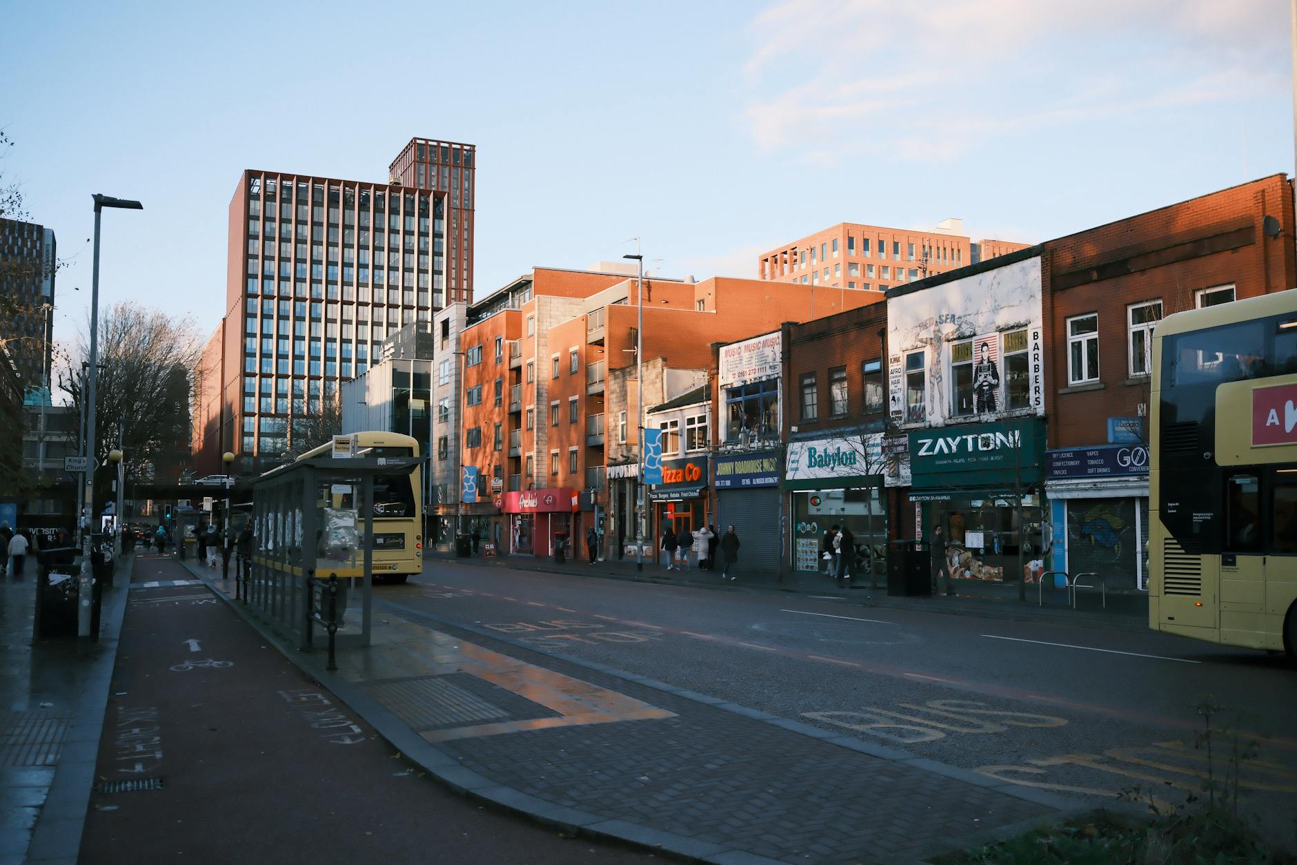 Manchester city street with modern architecture and public transit
