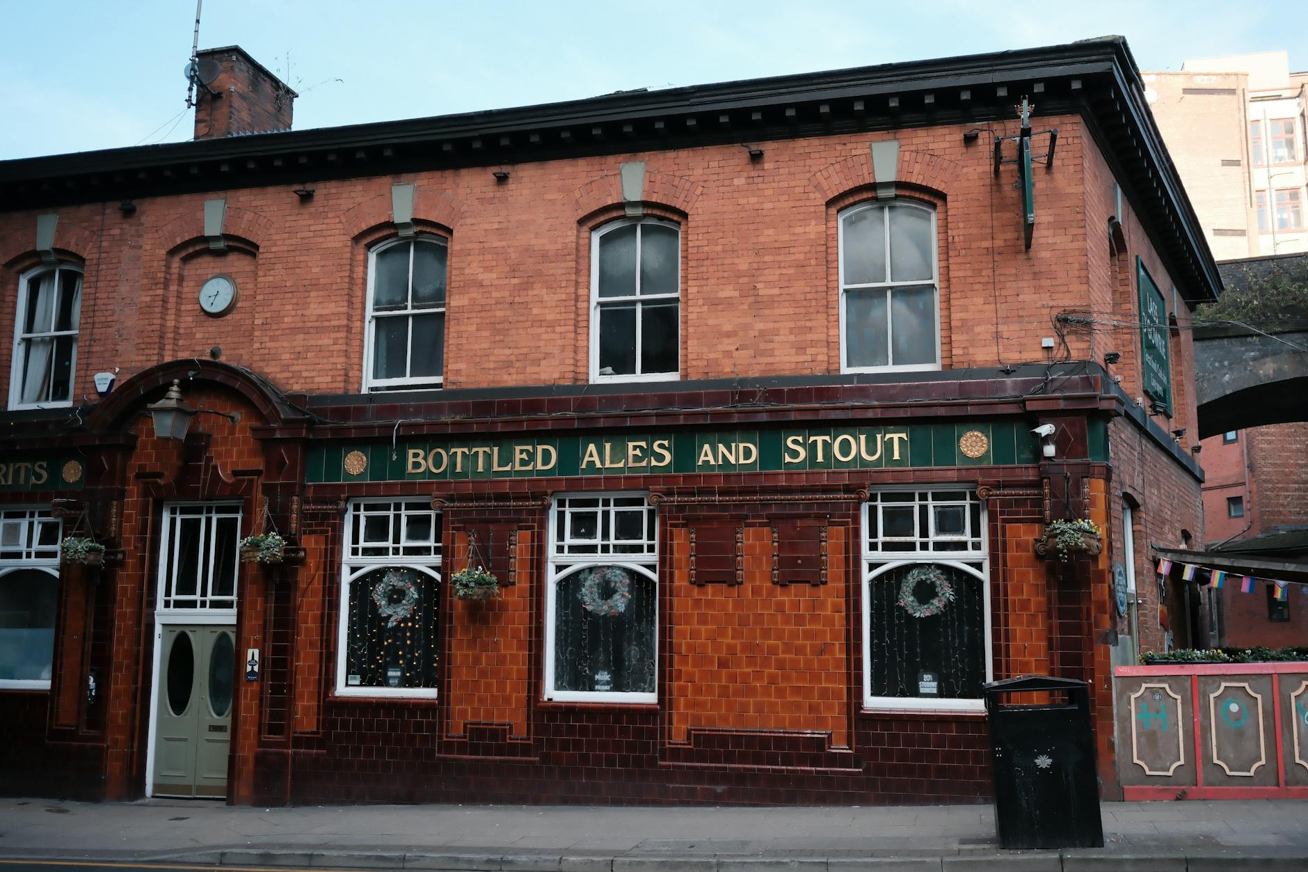 Classic red brick pub exterior on a Manchester city street