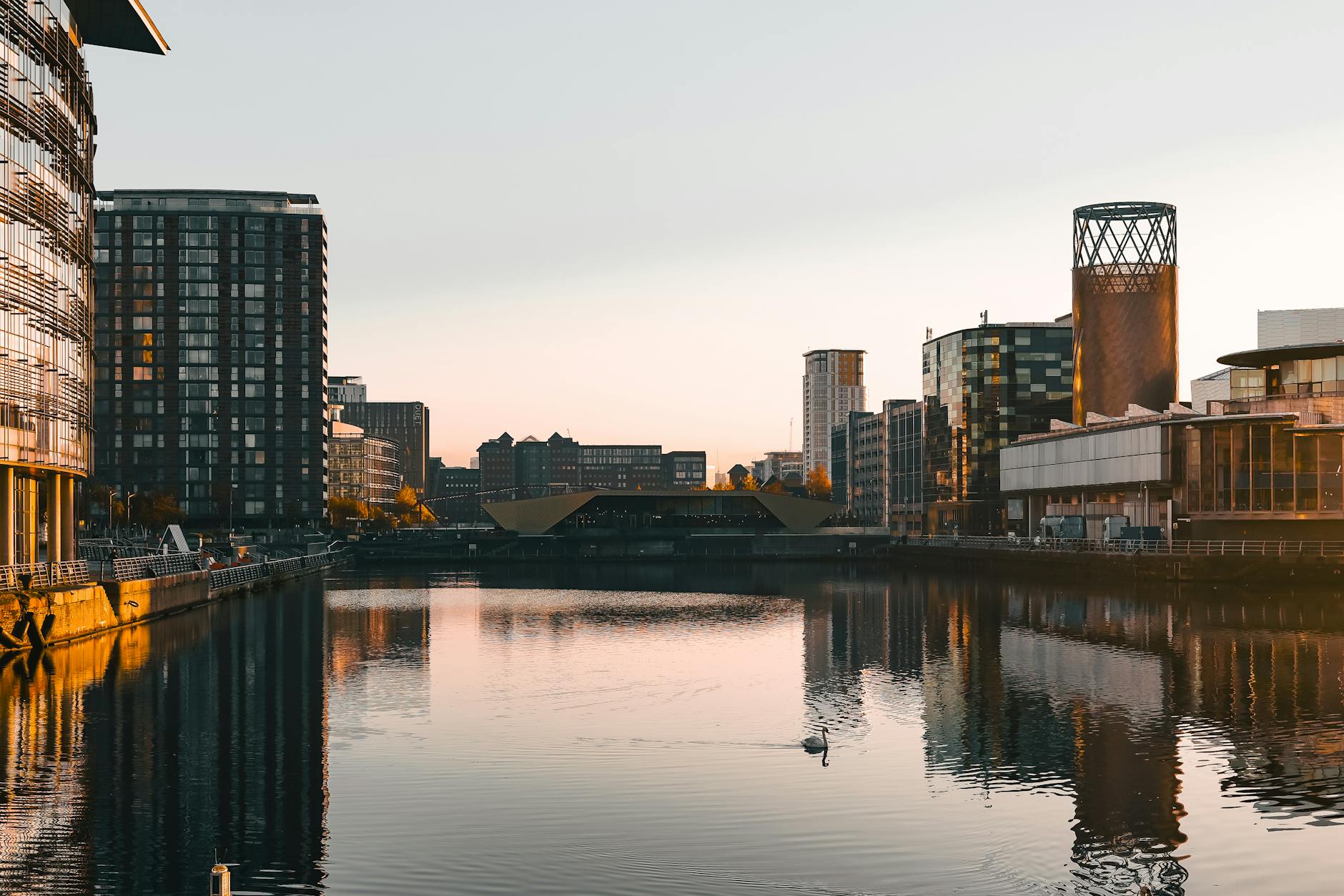 Salford Quays waterfront at dusk with modern architecture
