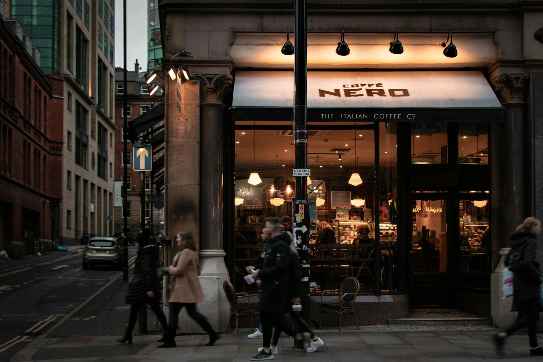 Manchester coffee shop street scene with pedestrians