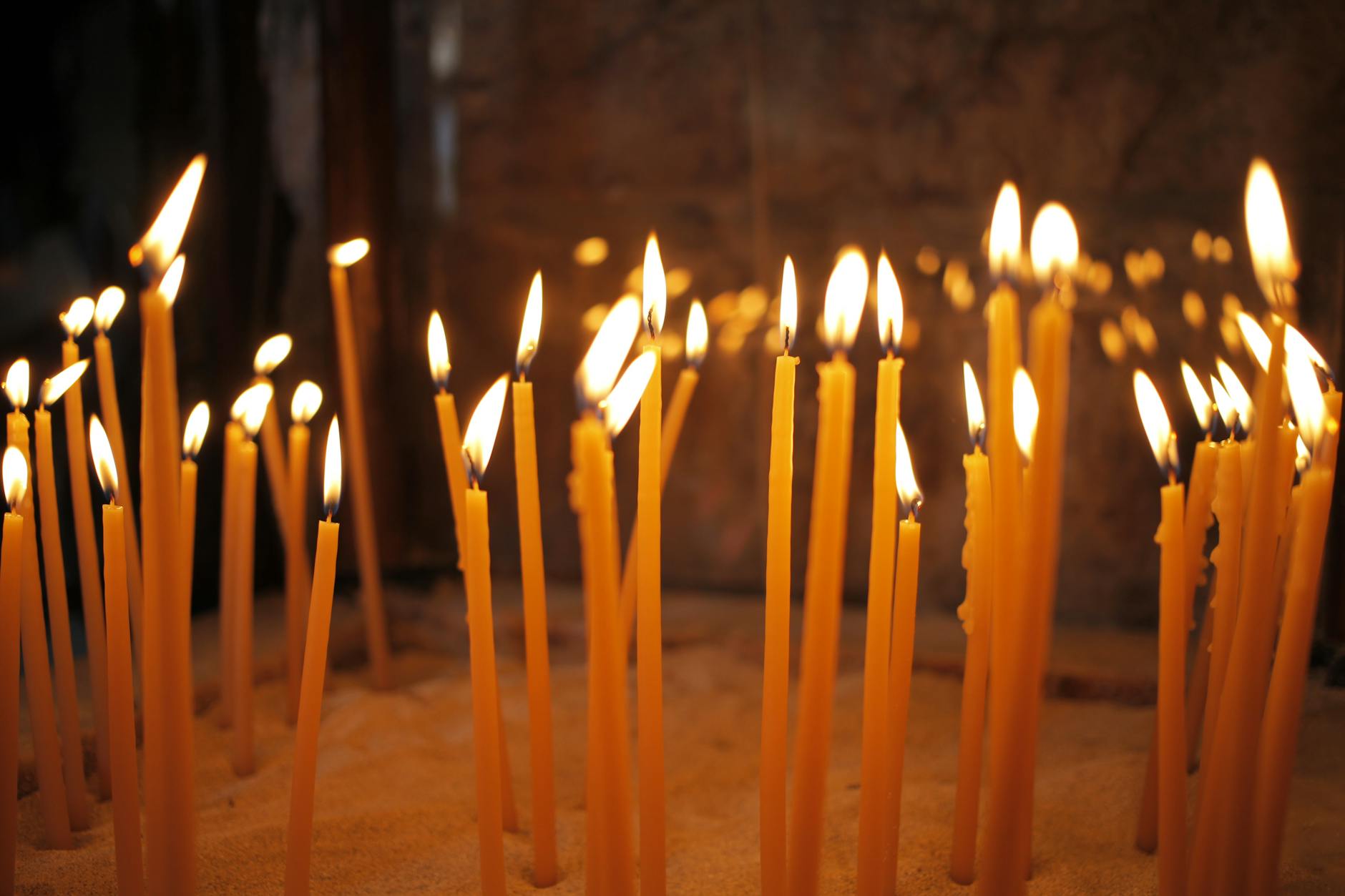 Burning candles inside a church setting