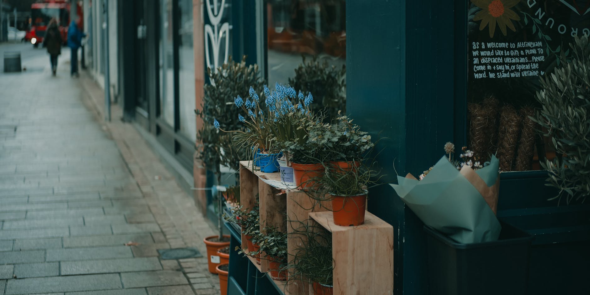 Flower shop exterior with plants and street view in Altrincham