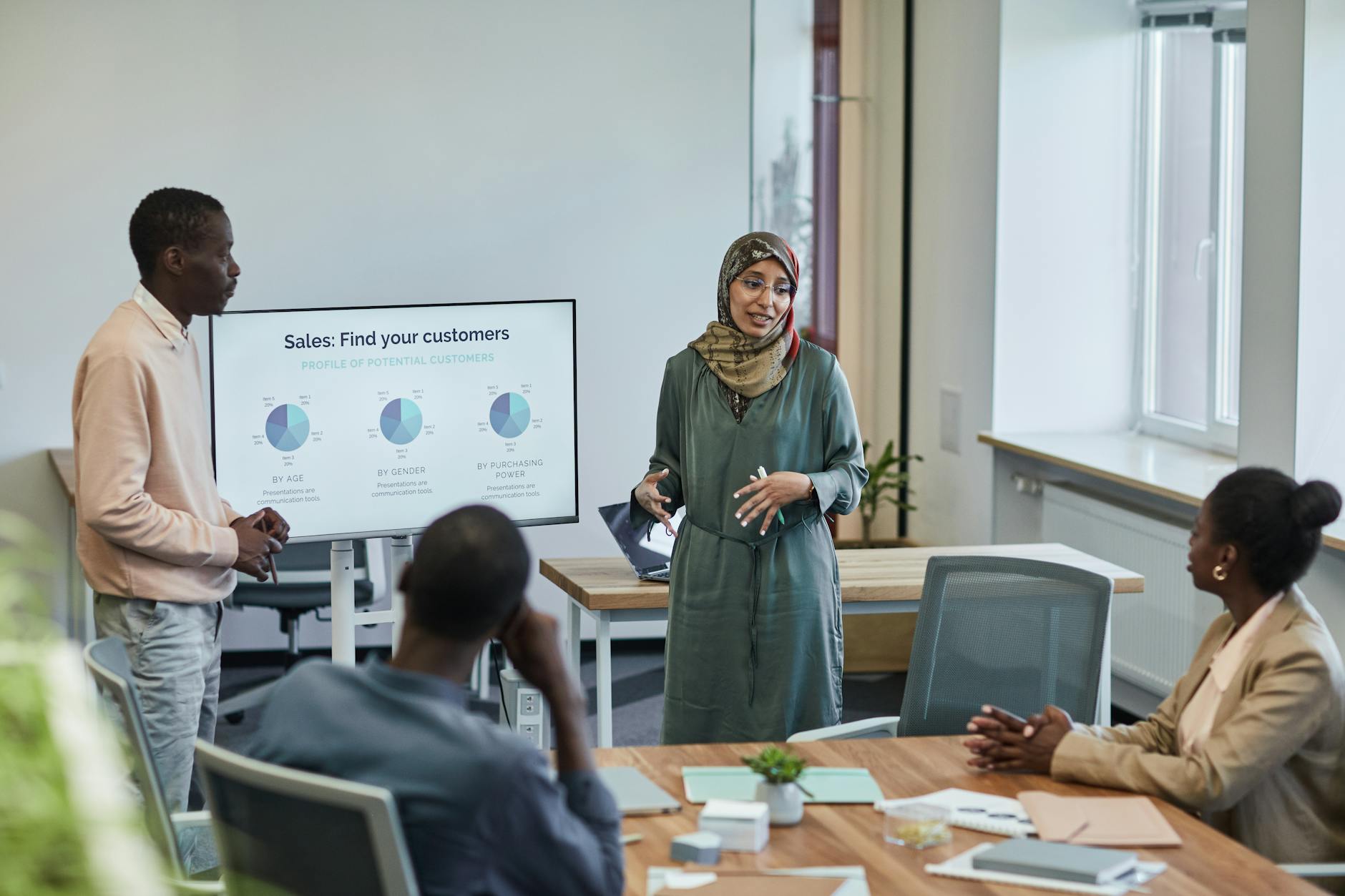 Professionals discussing sales strategy in a meeting room