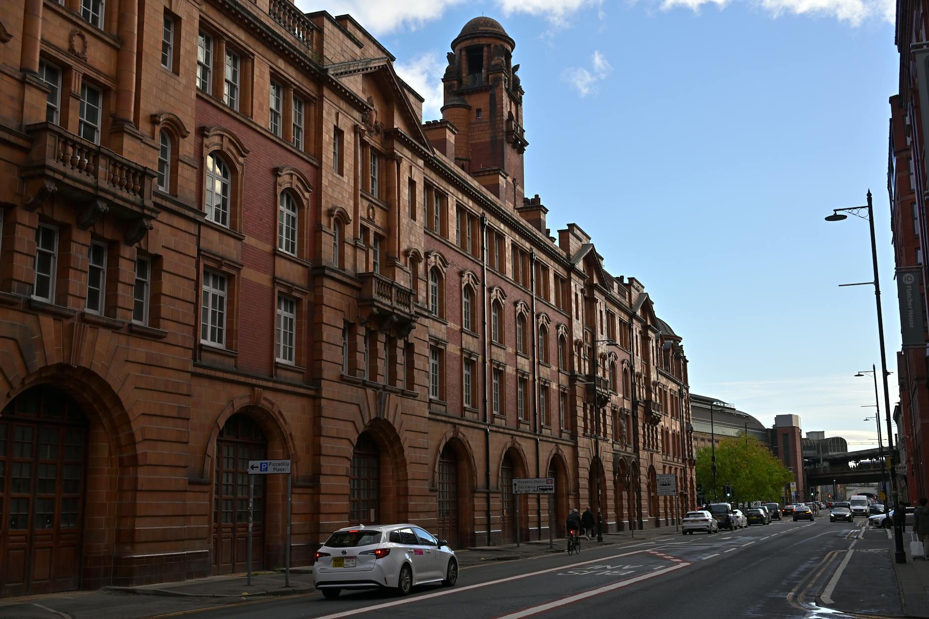 Historic Manchester red brick street for checking hotel approach and pavements