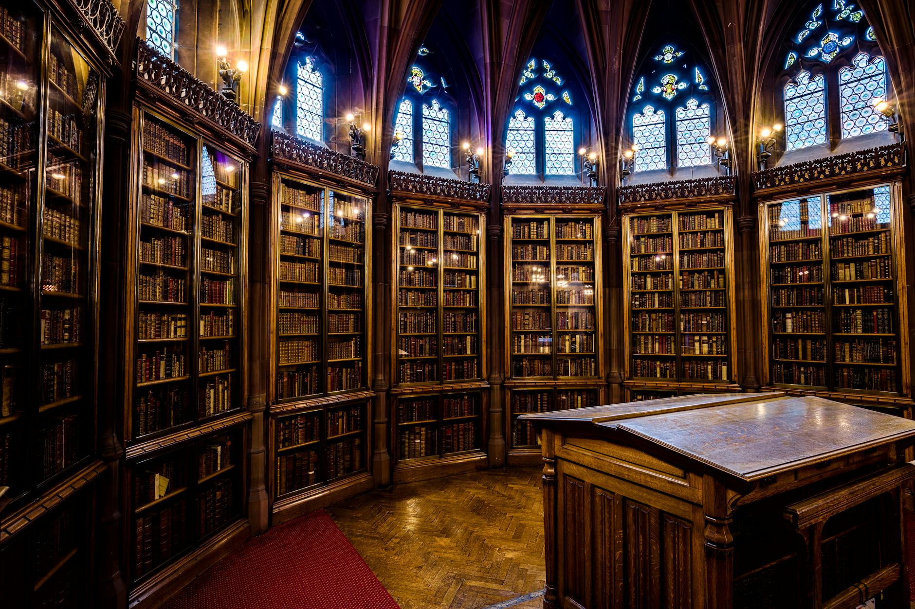 Historic Manchester library room with Gothic architecture and bookshelves