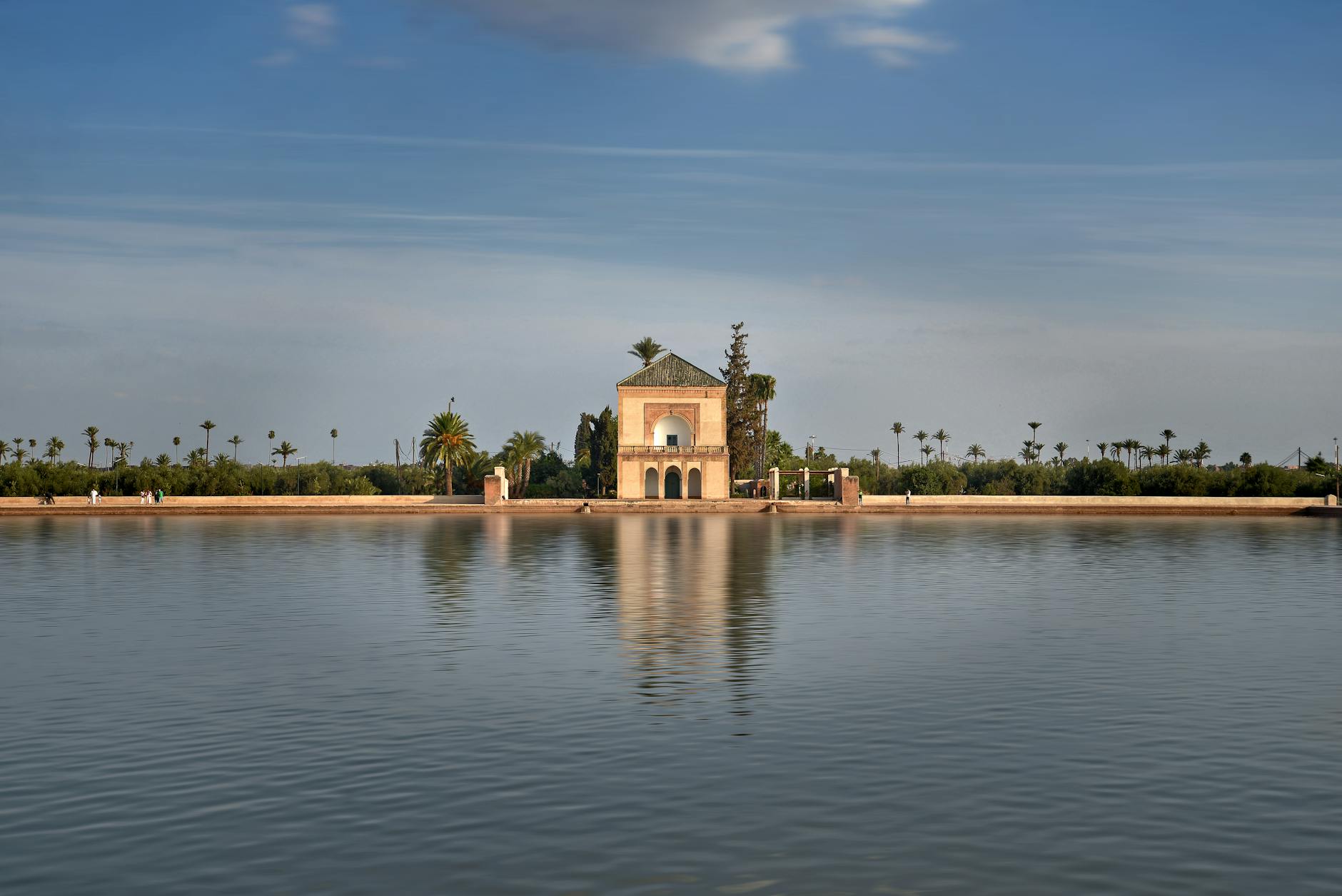 Menara Gardens pavilion reflected in water in Marrakech