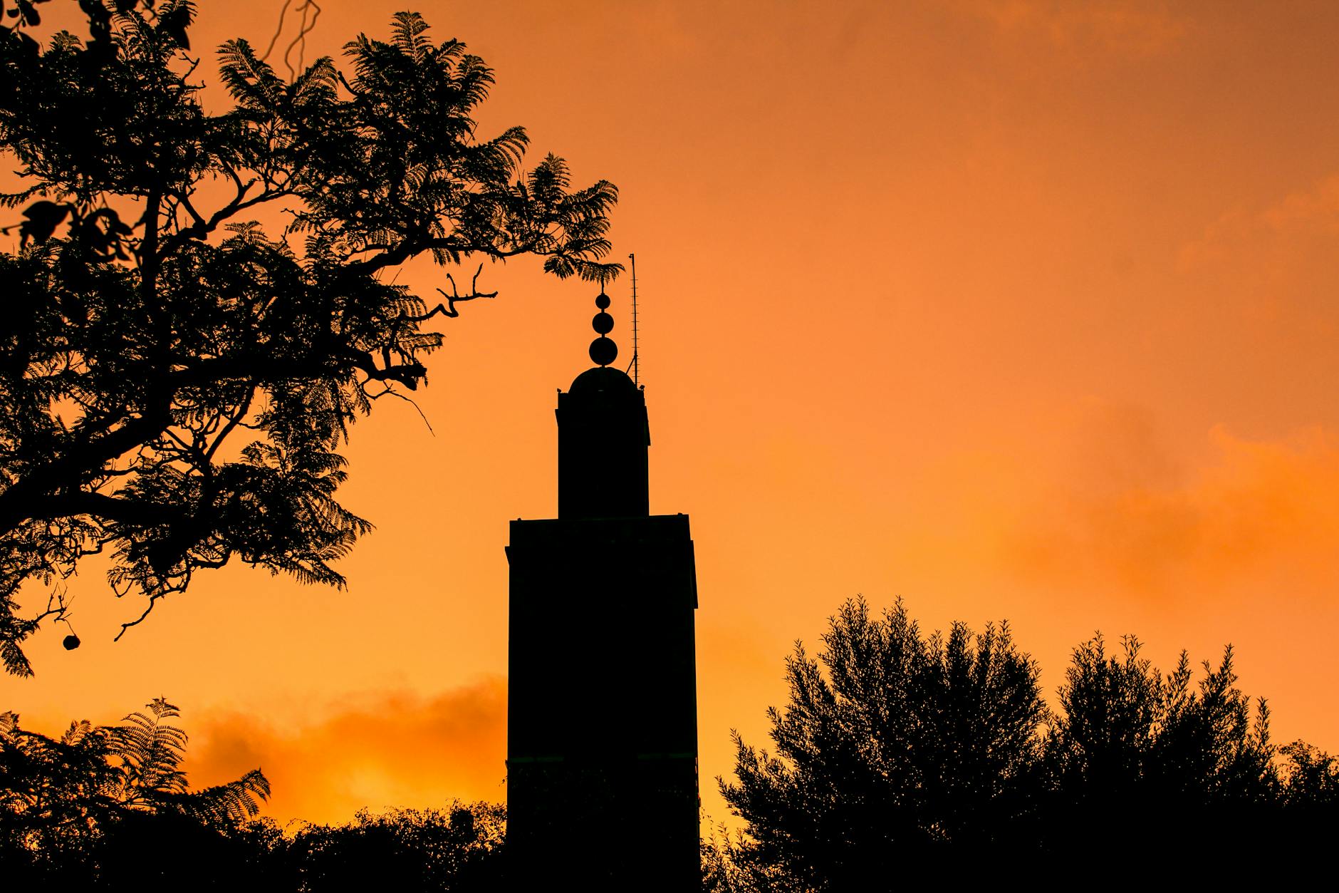 Silhouette of a Moroccan minaret at sunset