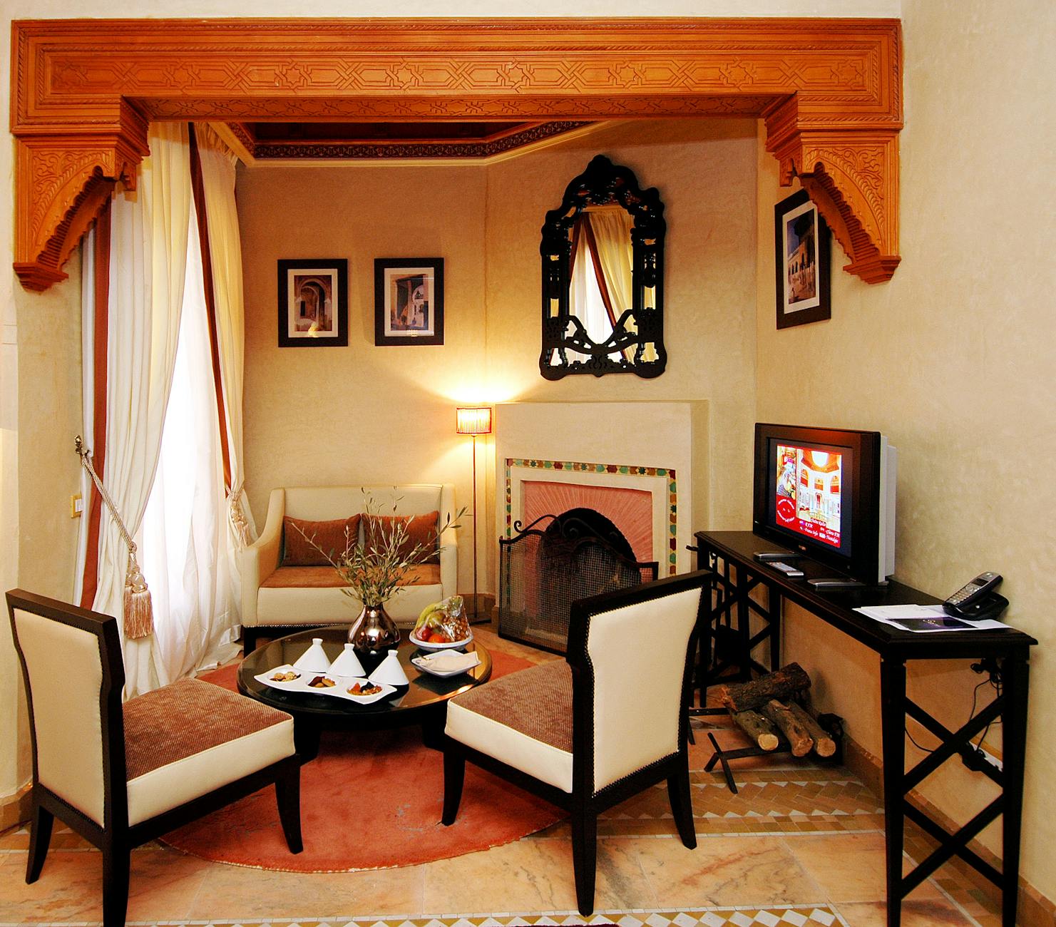 Warm Moroccan interior with traditional decor and a fireplace
