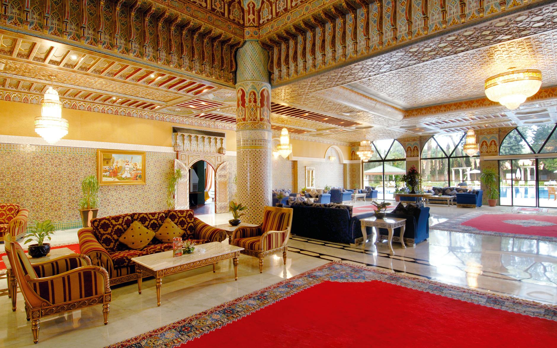 Moroccan-style hotel lobby with ornate seating and chandeliers