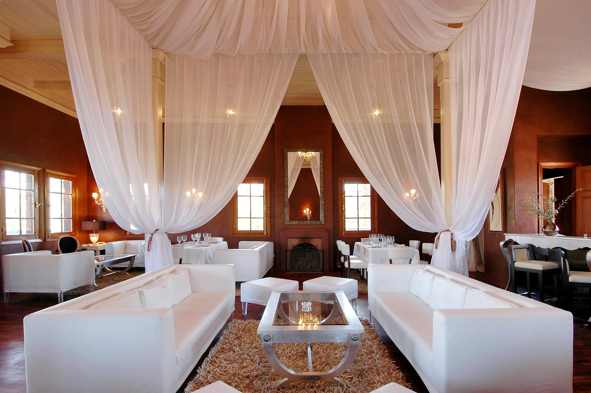 Elegant Marrakech restaurant dining room with draped ceilings