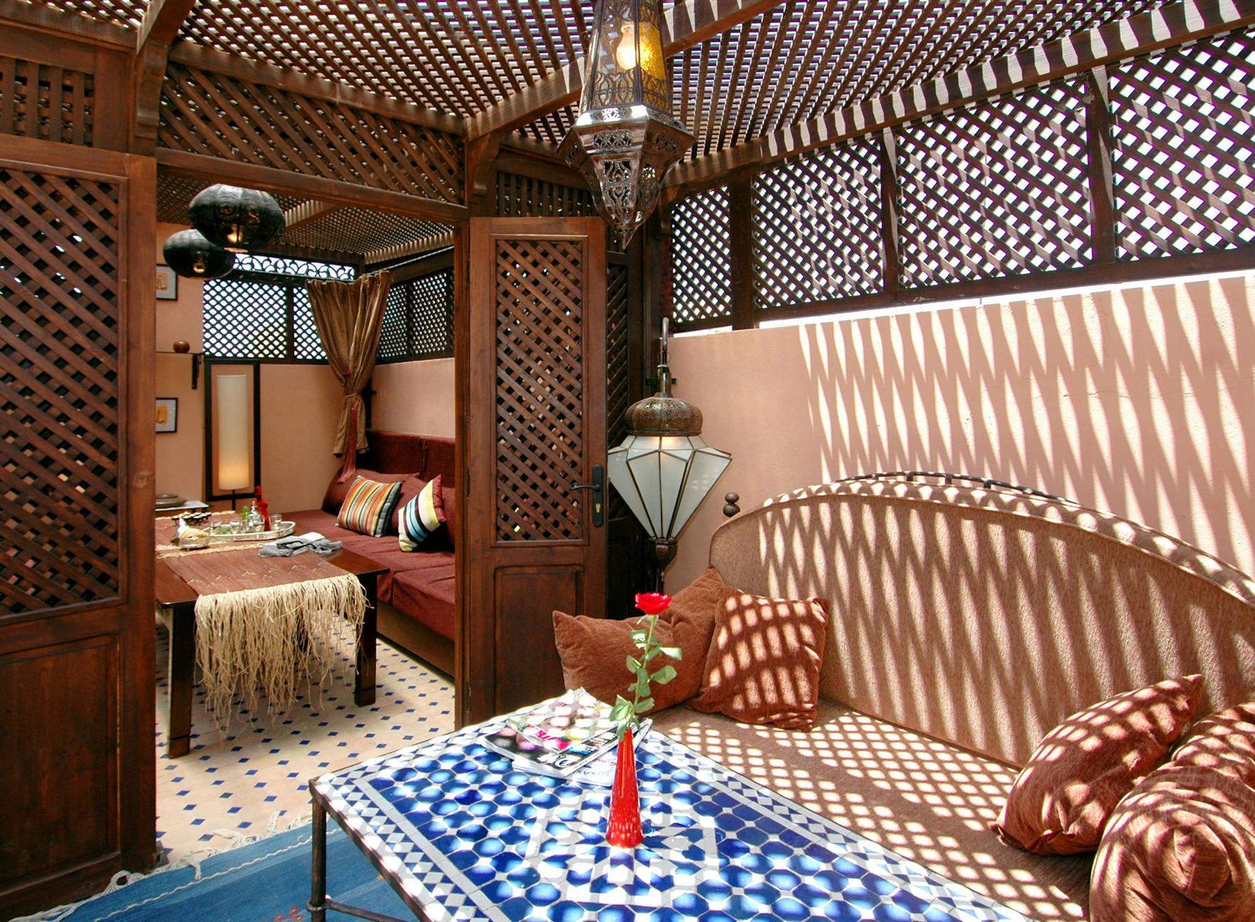 Traditional Moroccan interior with sunlight and ornate decor