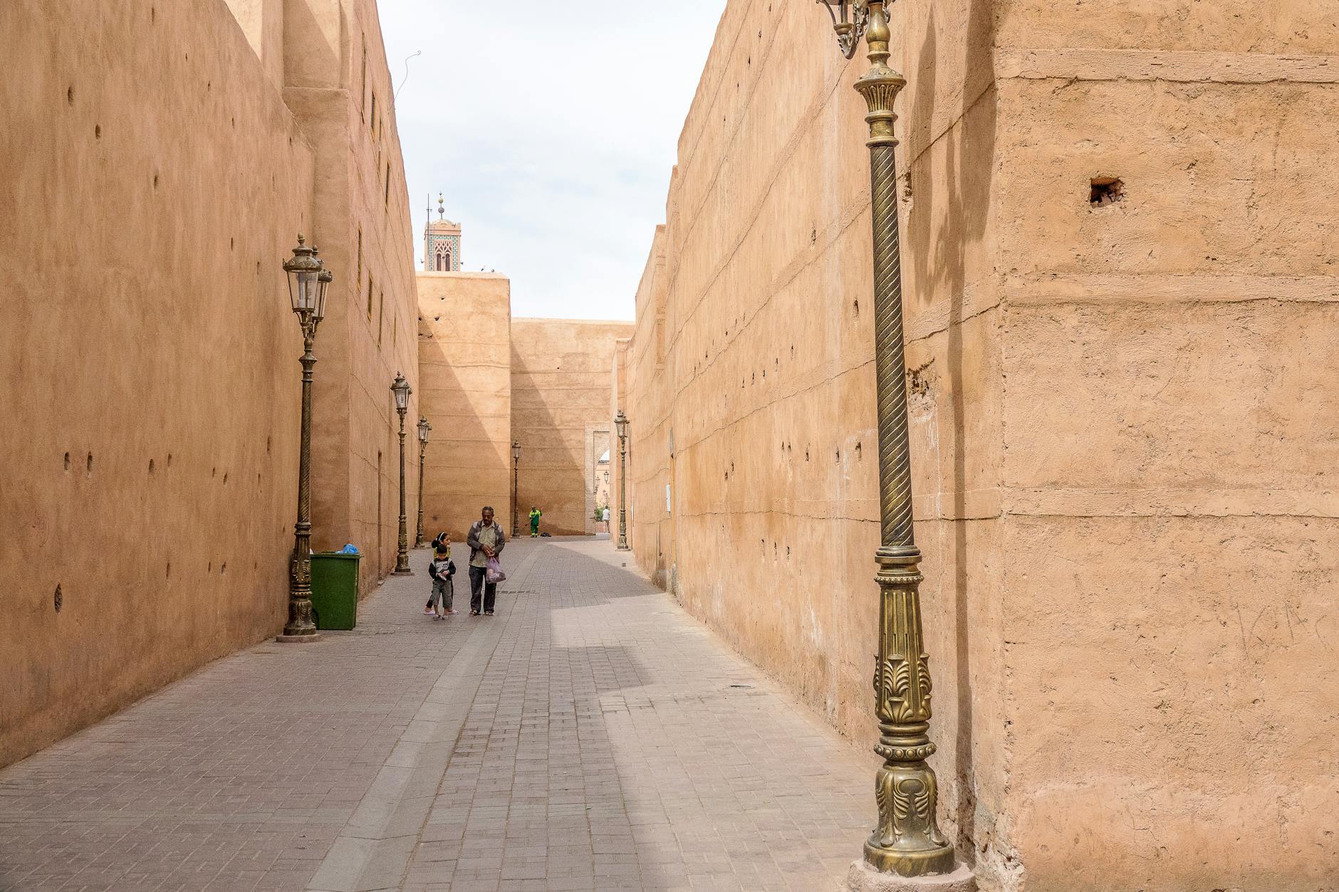 Narrow stone alley with traditional lamps in a Moroccan old city