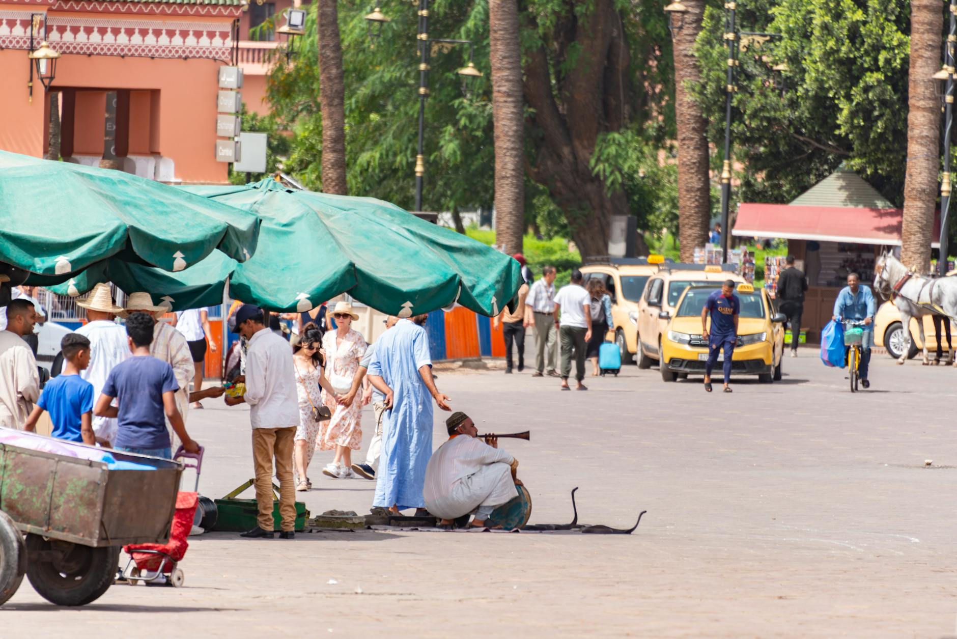 Jemaa el-Fnaa square in Marrakech with visitors and performers