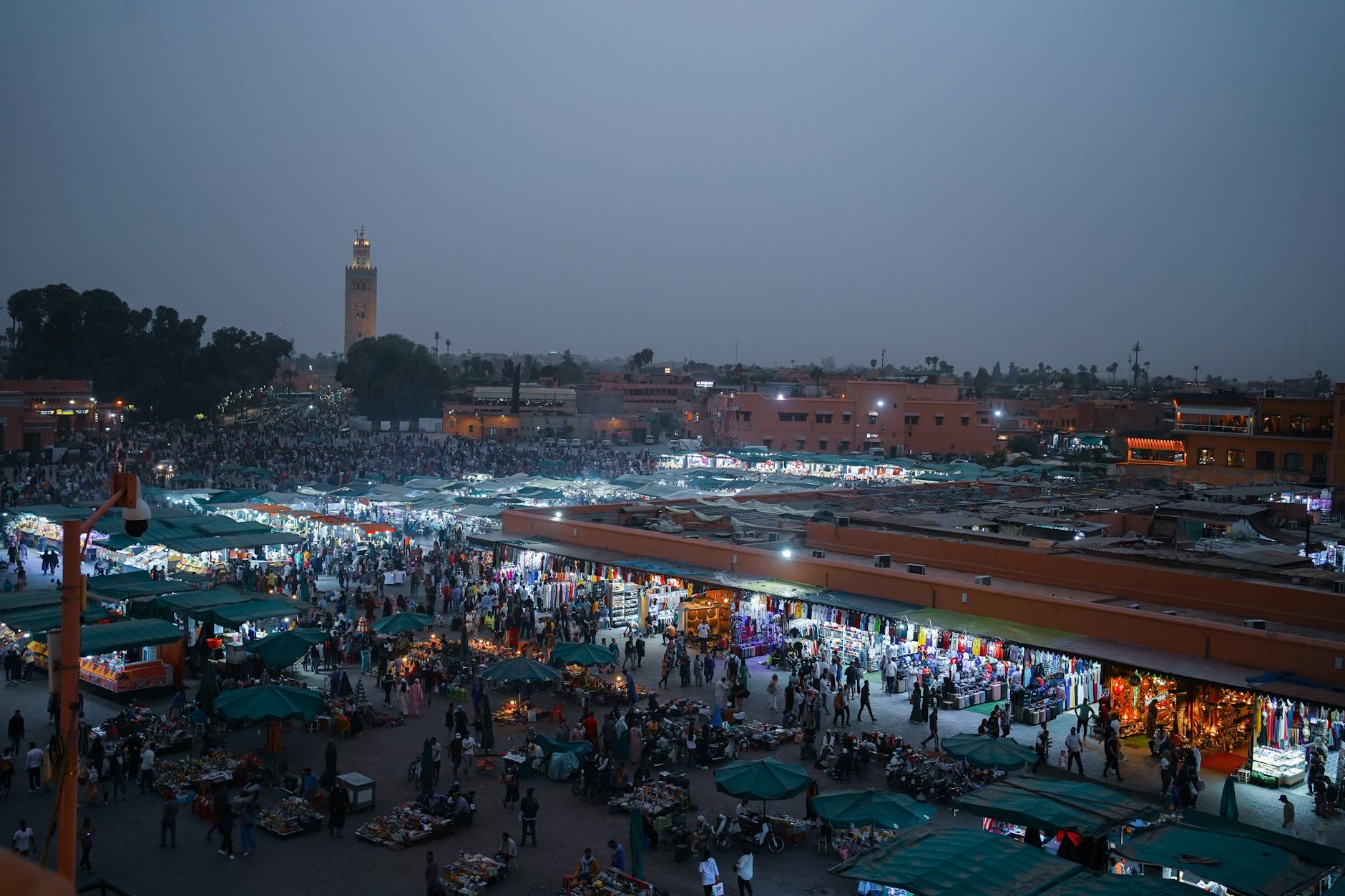Aerial view of a lively evening marketplace in Marrakech