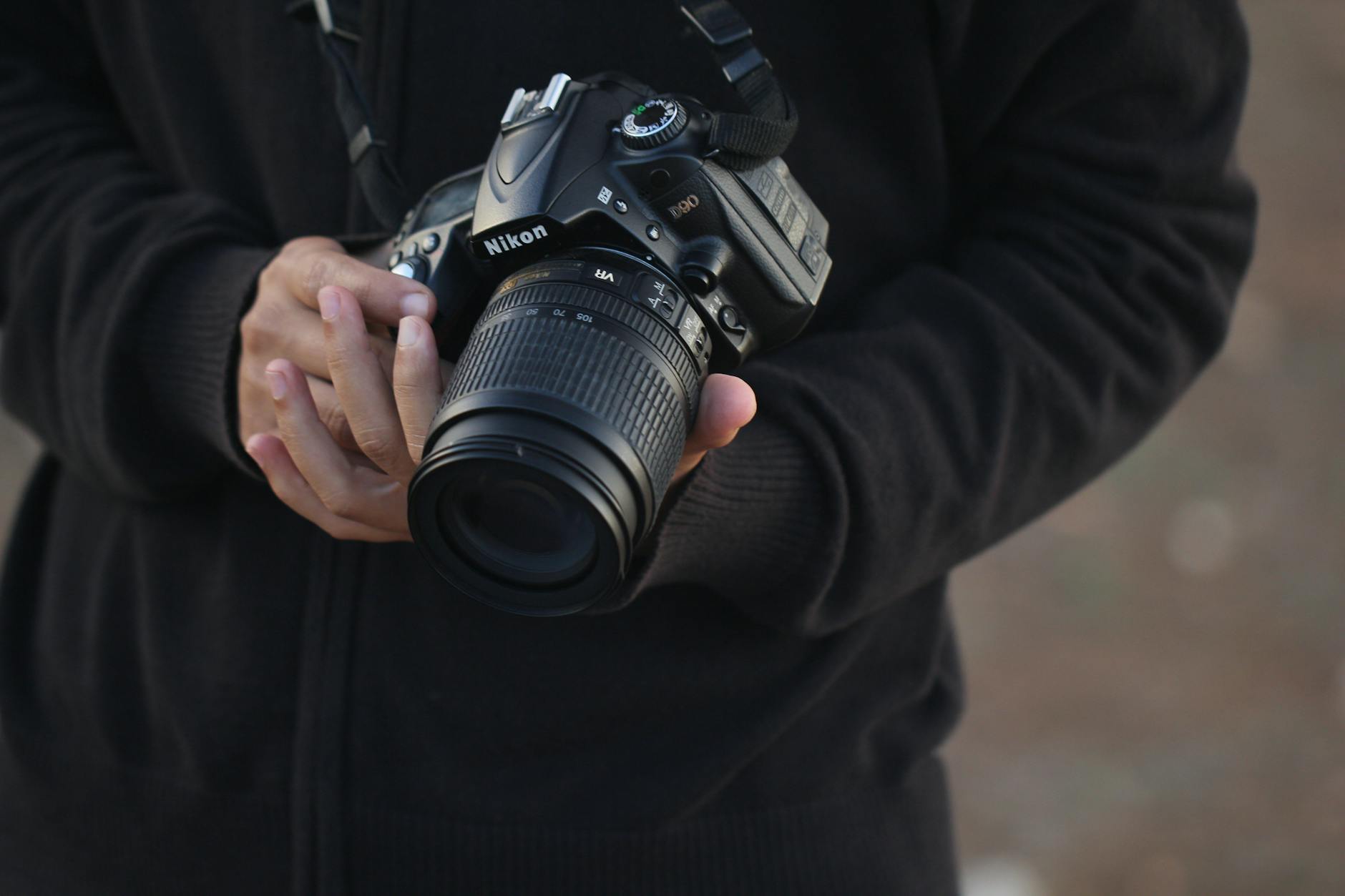 Photographer holding a DSLR camera in Morocco