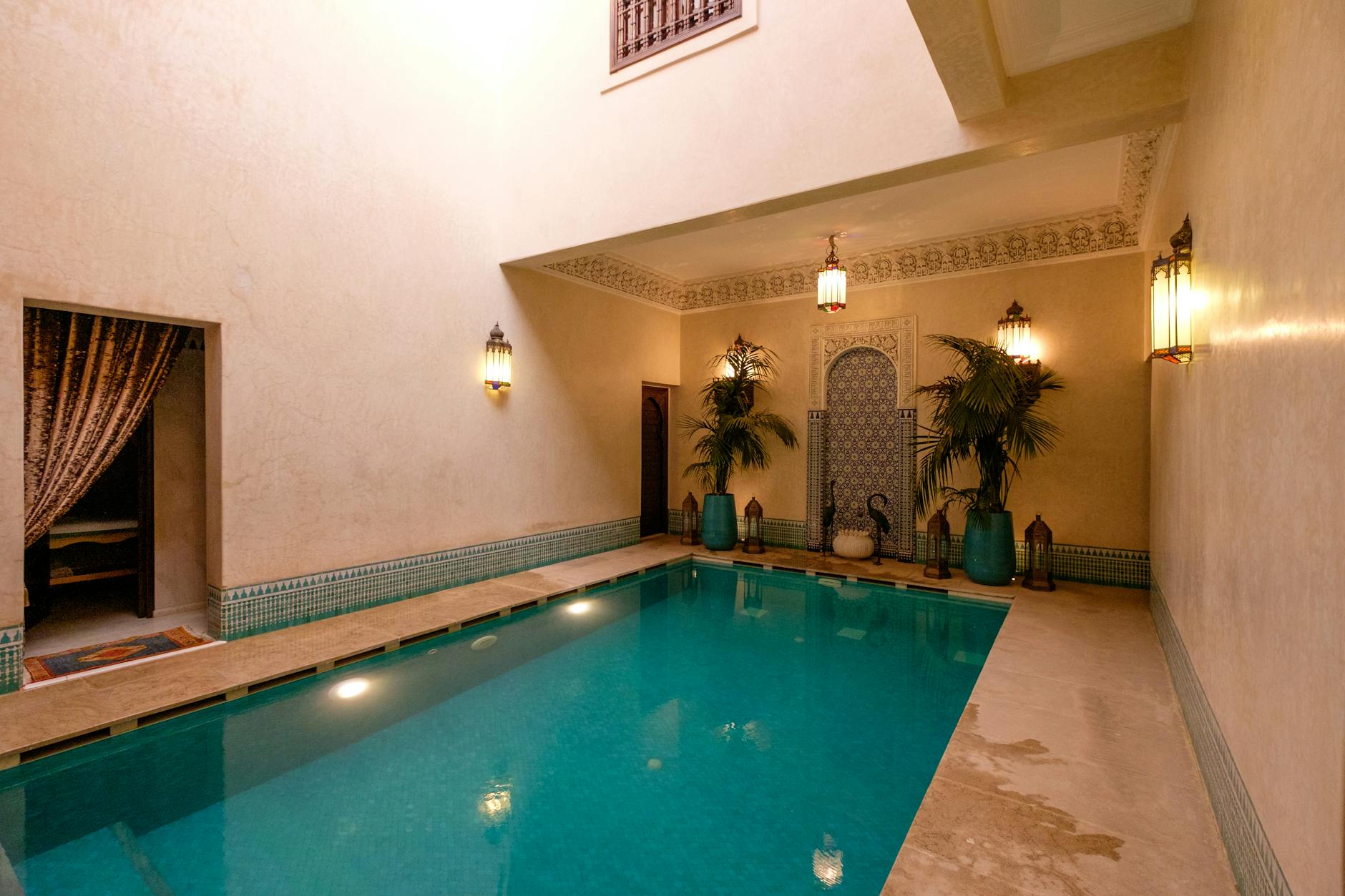 Indoor riad pool with traditional Moroccan architecture