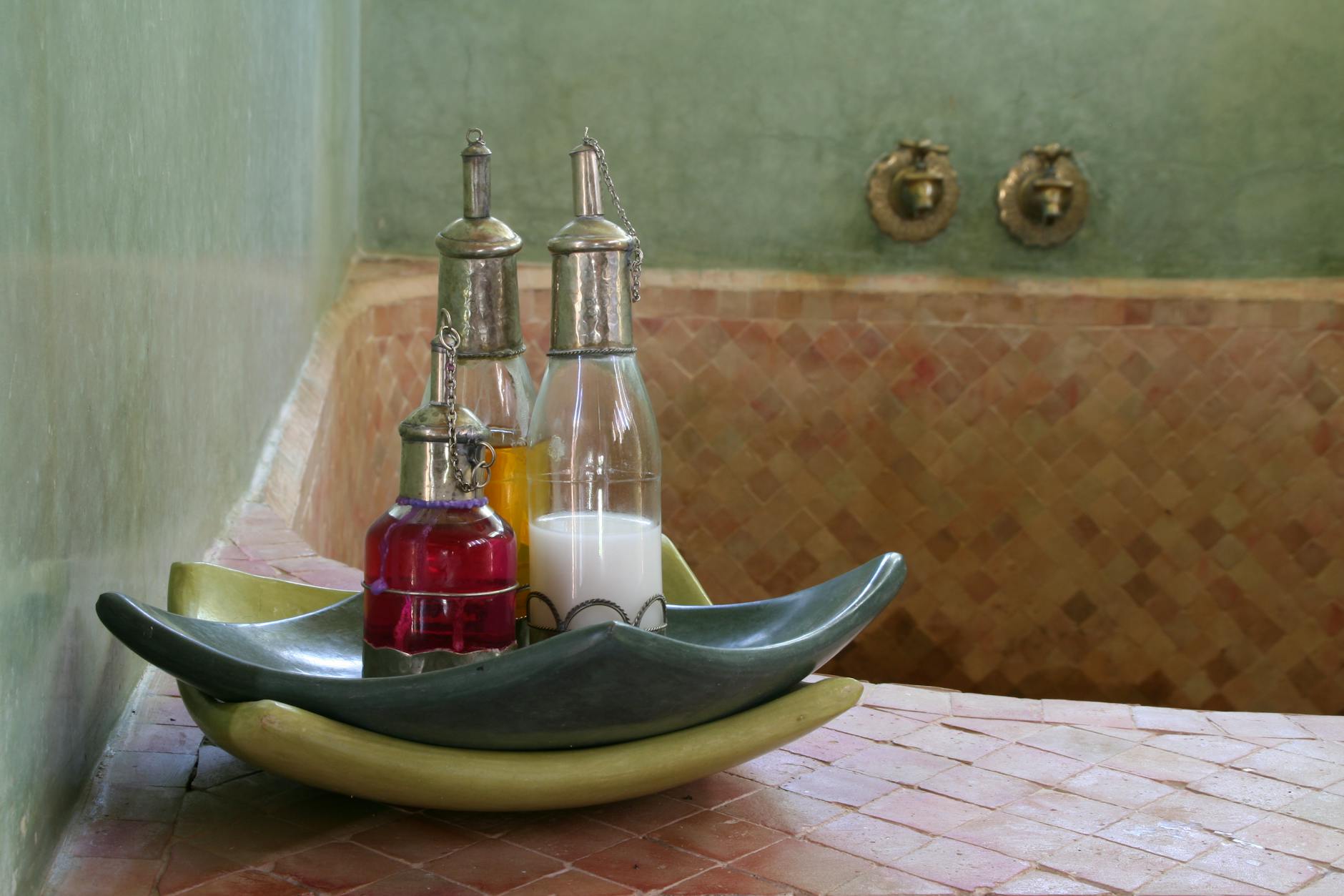 Traditional Moroccan hammam interior with oils
