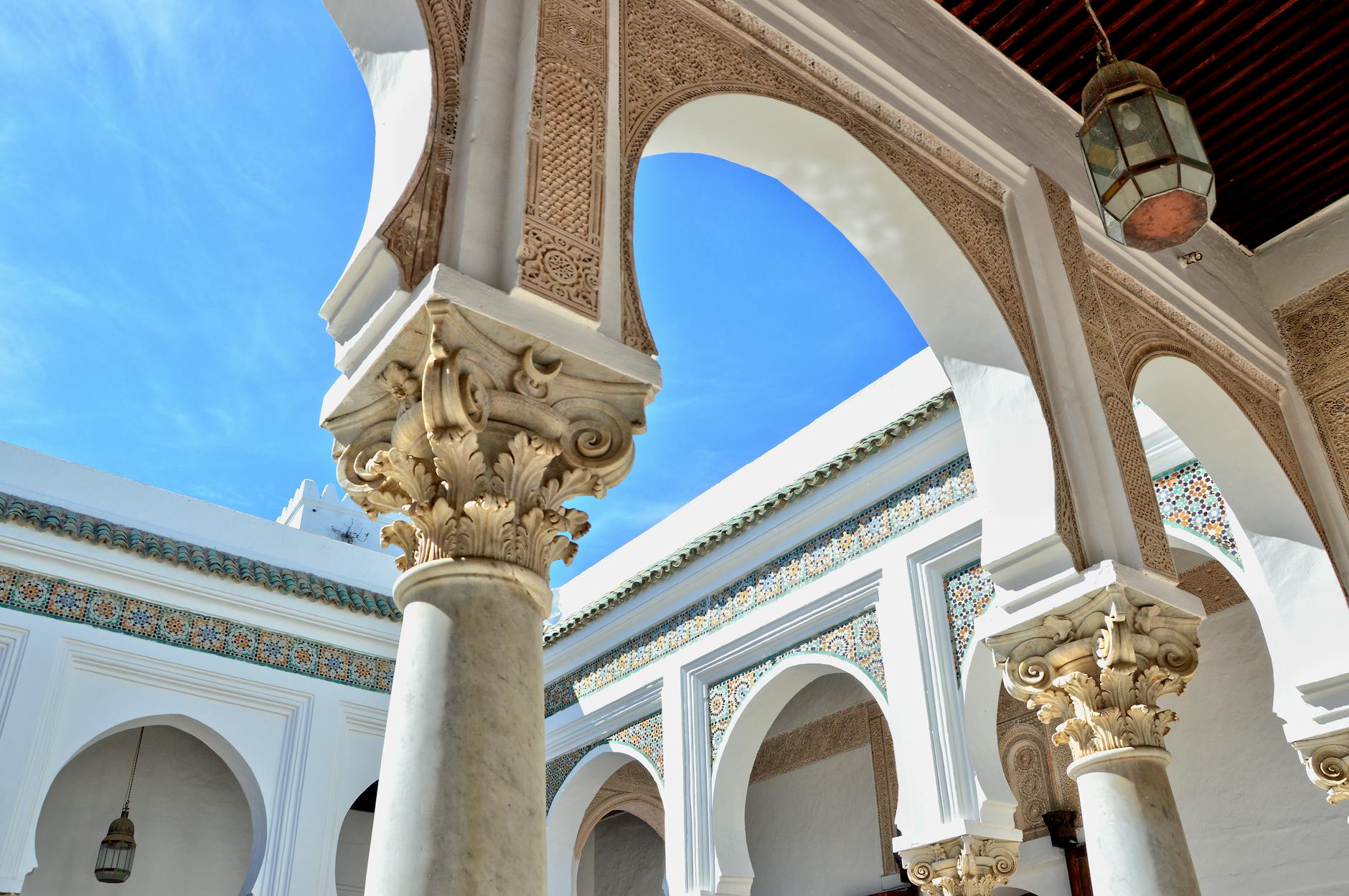 Ornate Moroccan courtyard with arches and columns
