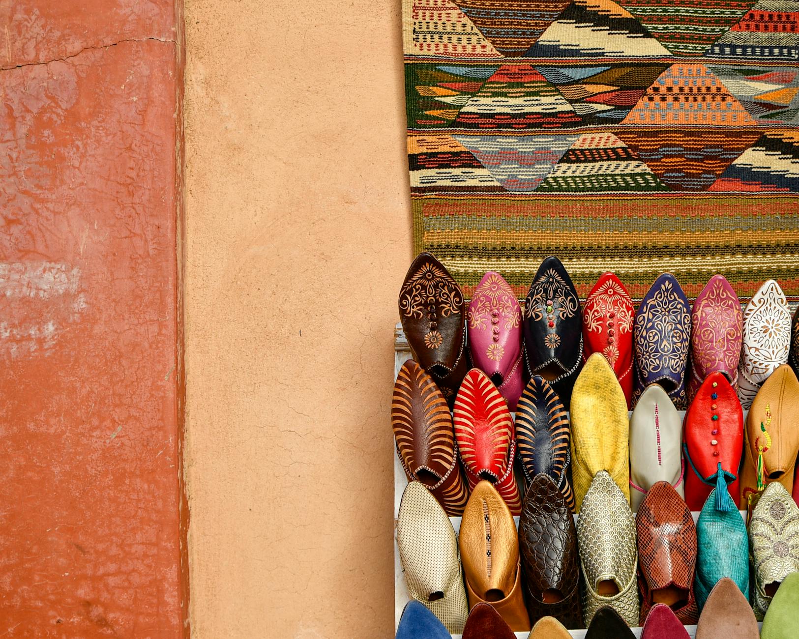 Colorful traditional Moroccan slippers displayed in a Marrakesh market