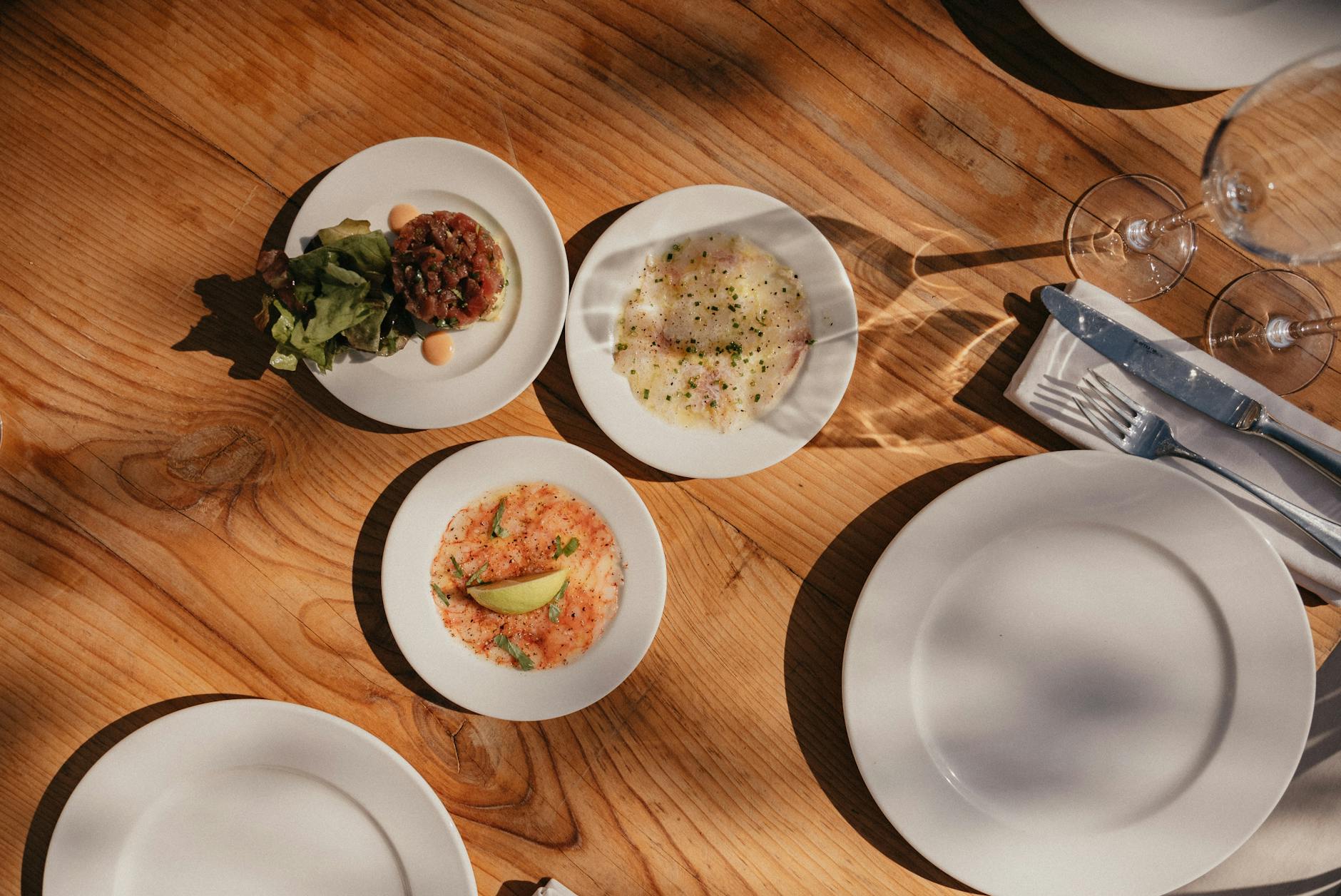 Elegant Moroccan dining table with appetizers and white plates