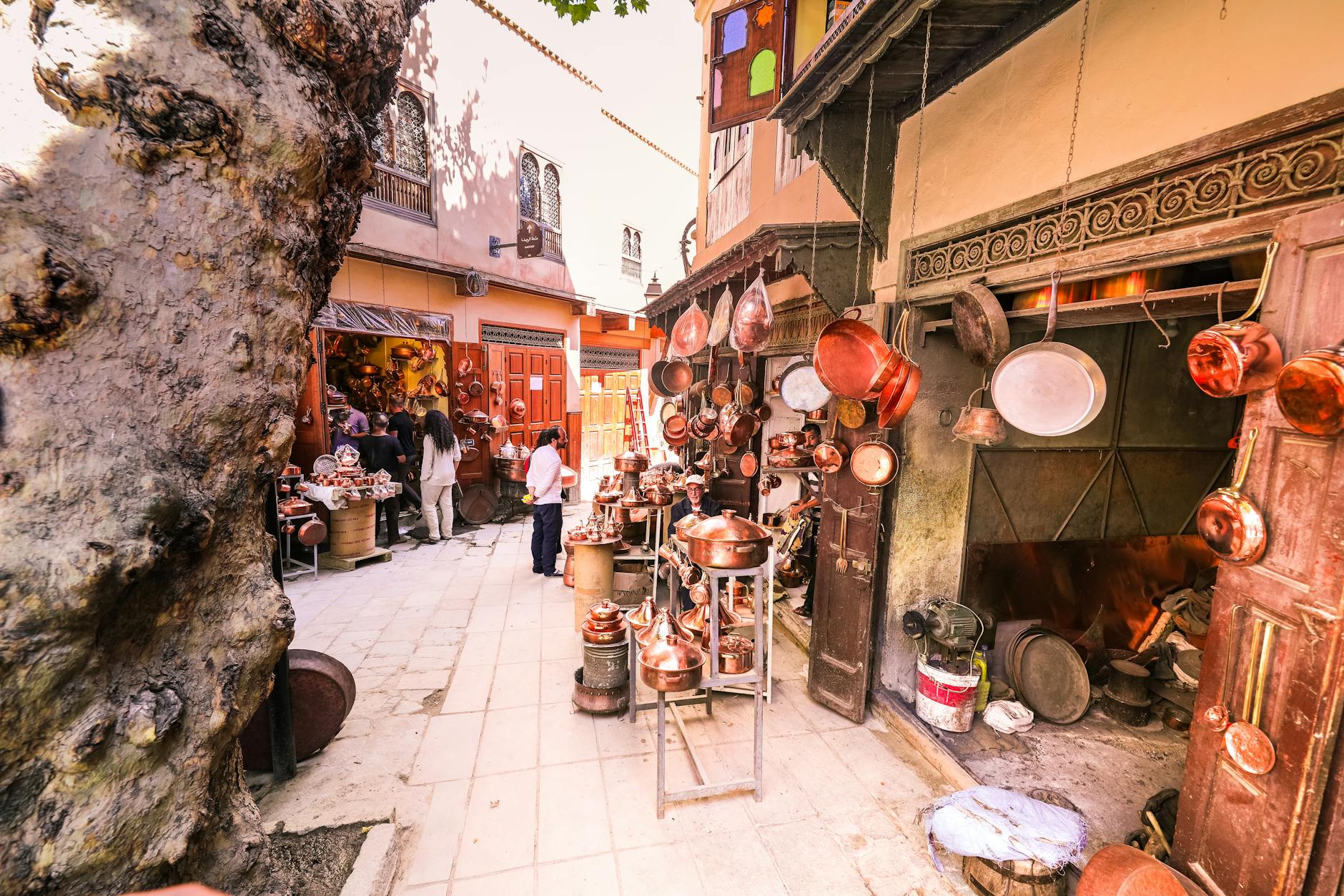 Hanging brass pots in a Moroccan market display