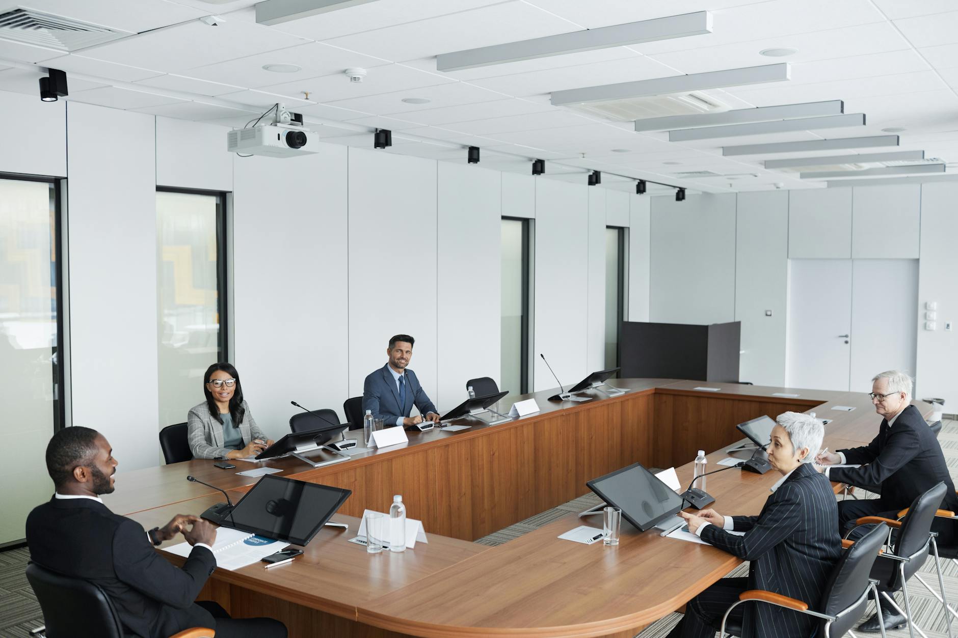 Business professionals seated around a conference table