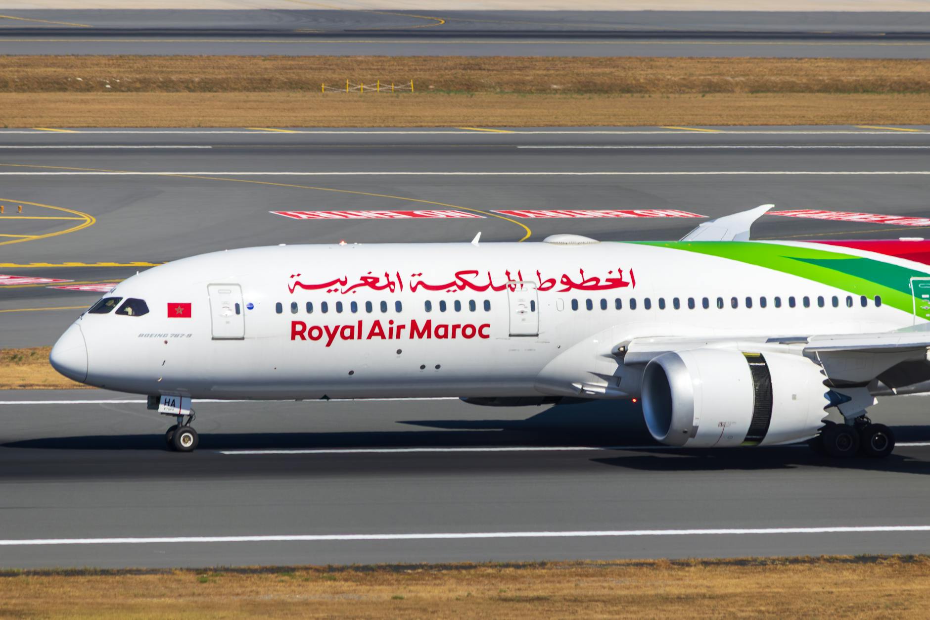 Royal Air Maroc airplane taxiing on an airport runway