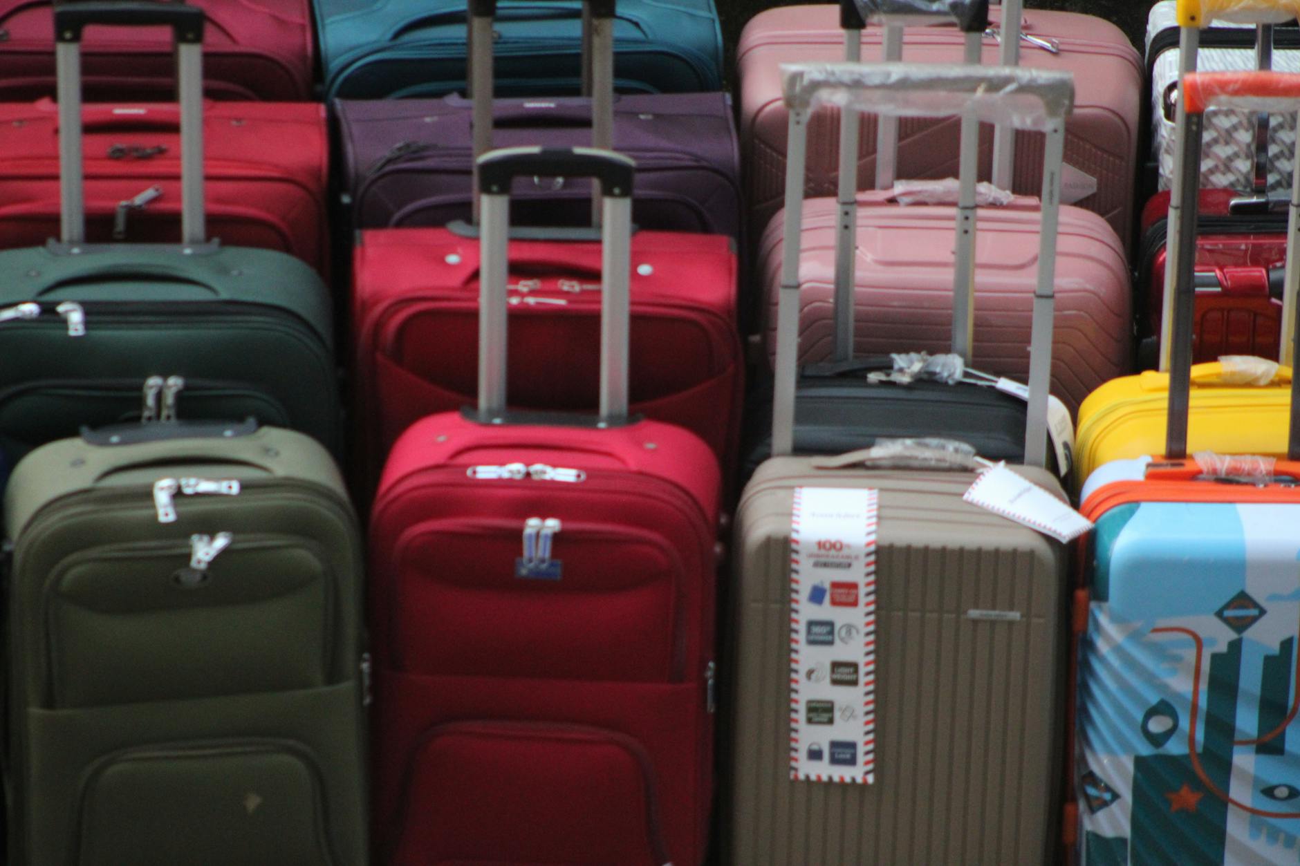 Colorful suitcases stacked for travel