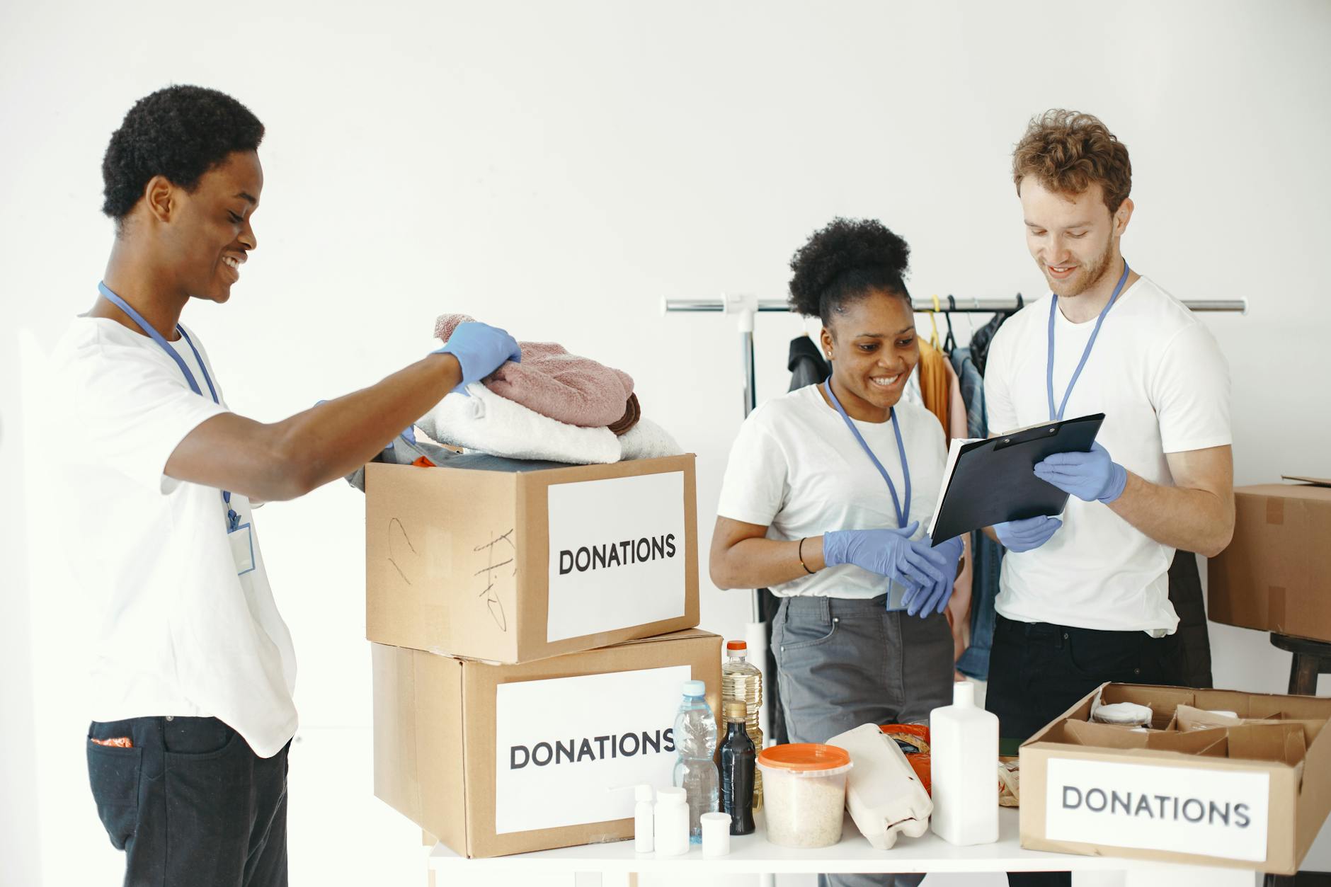 Volunteers sorting donation boxes indoors