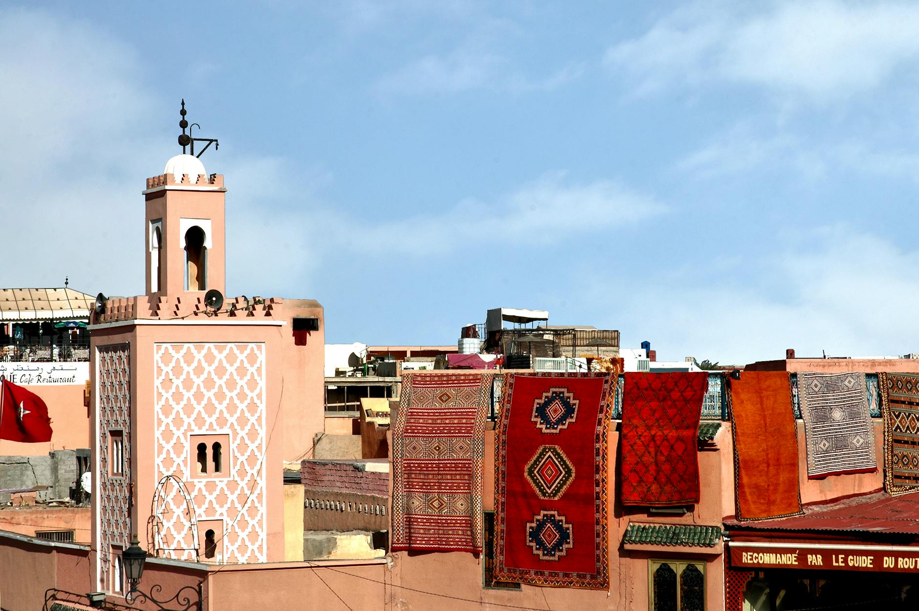 Colorful Moroccan rugs on a rooftop in Marrakech