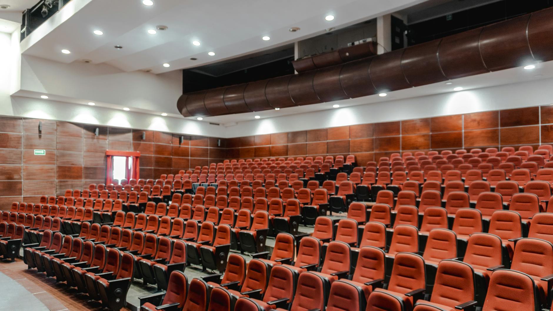 Contemporary auditorium interior with red seating