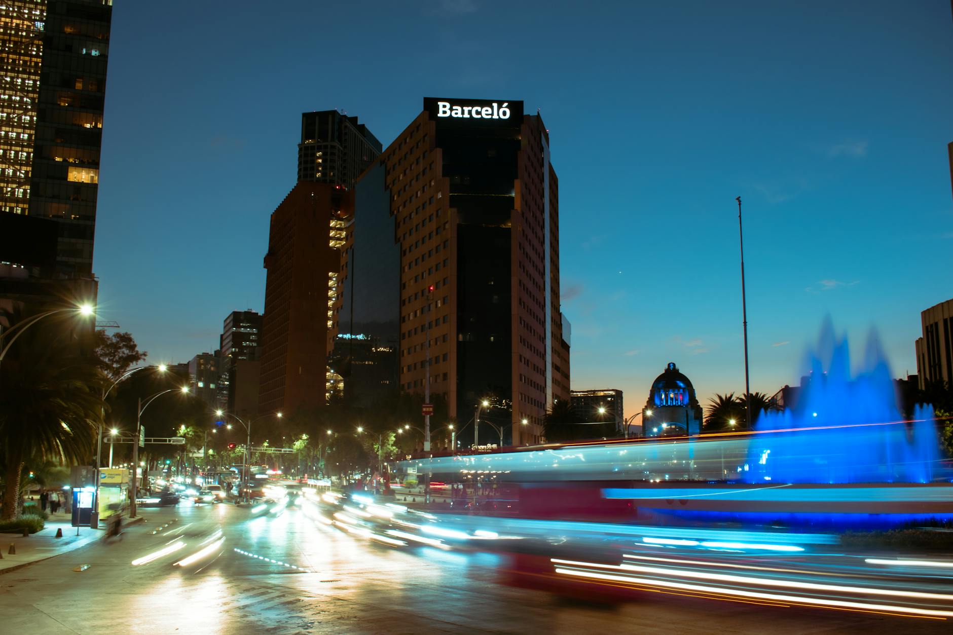 Nighttime traffic in Mexico City with city lights